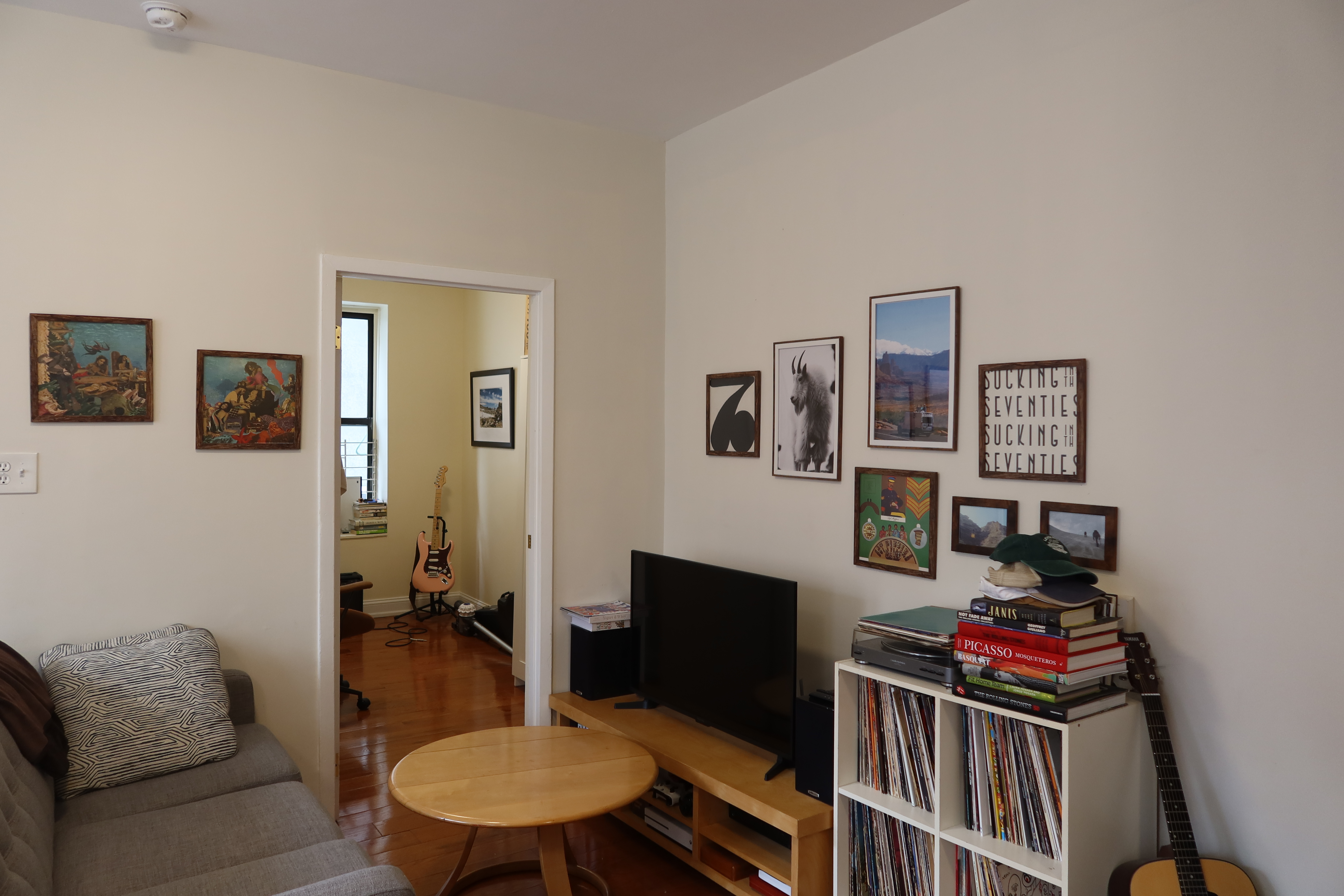56 Stagg Street, Unit 4 Brooklyn, NY 11206 - Photo 8 of 11 a living room with furniture and a flat screen tv