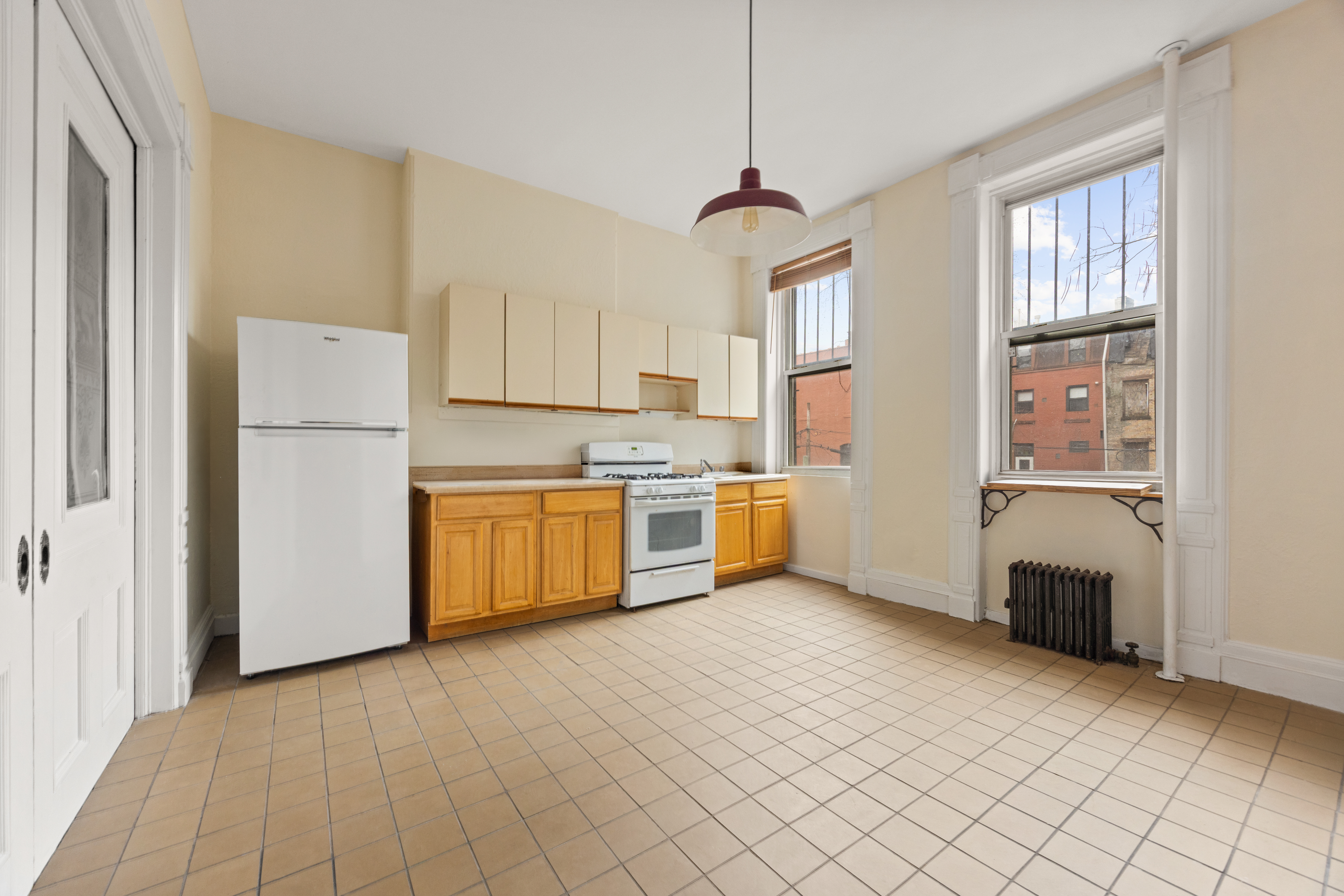 124 Quincy Street, Unit 2 Brooklyn, NY 11216 - Photo 5 of 6 a kitchen with stainless steel appliances a refrigerator sink and cabinets