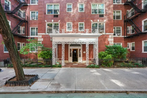 a front view of a building with garden