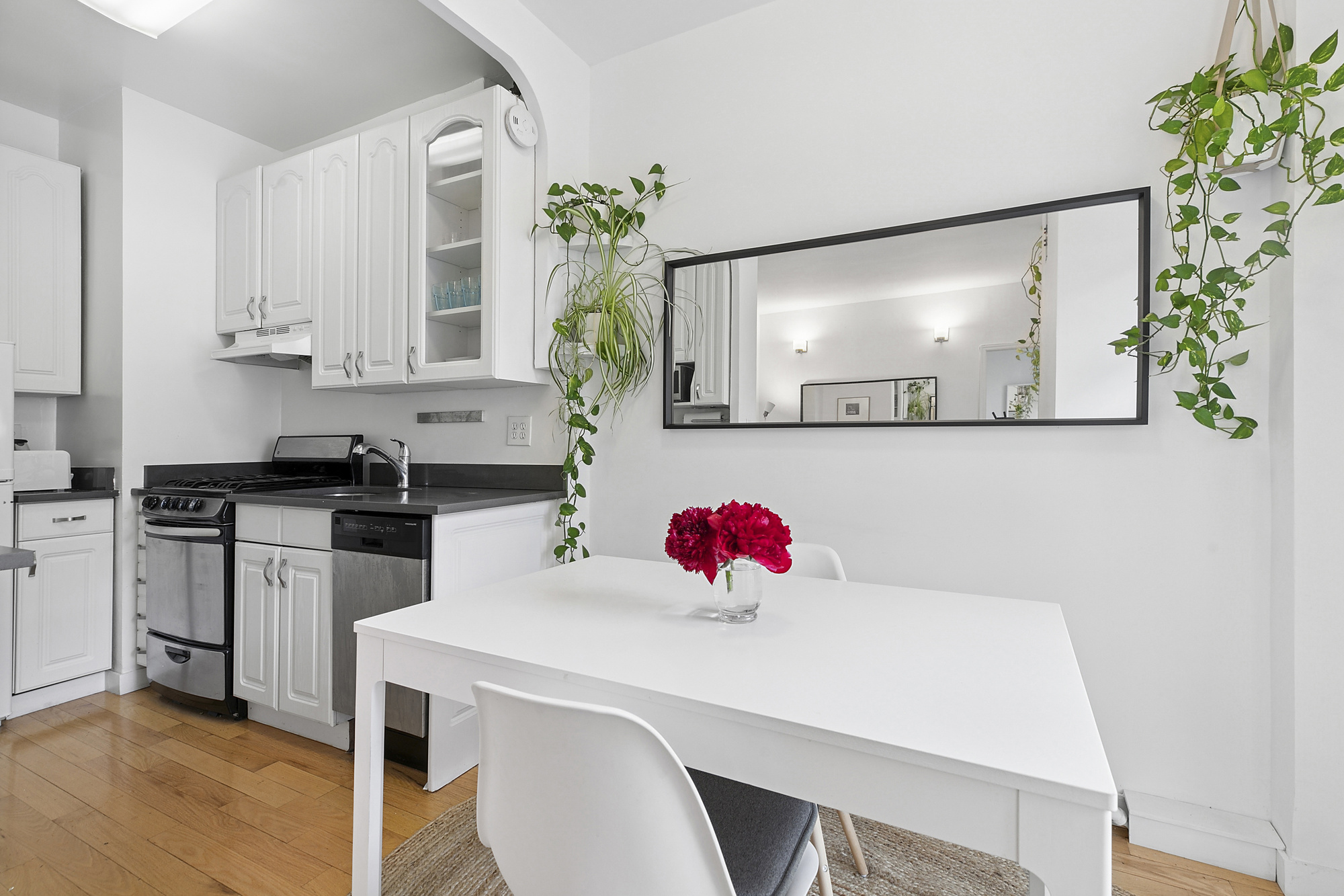 508 East 78th Street, Unit 6O Manhattan, NY 10075 - Photo 3 of 11 a kitchen with a sink cabinets and wooden floor
