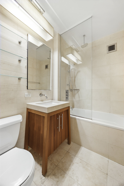 88 Greenwich Street, Unit 1025 Manhattan, NY 10006 - Photo 4 of 14 a bathroom with a bathtub shower sink mirror and toilet