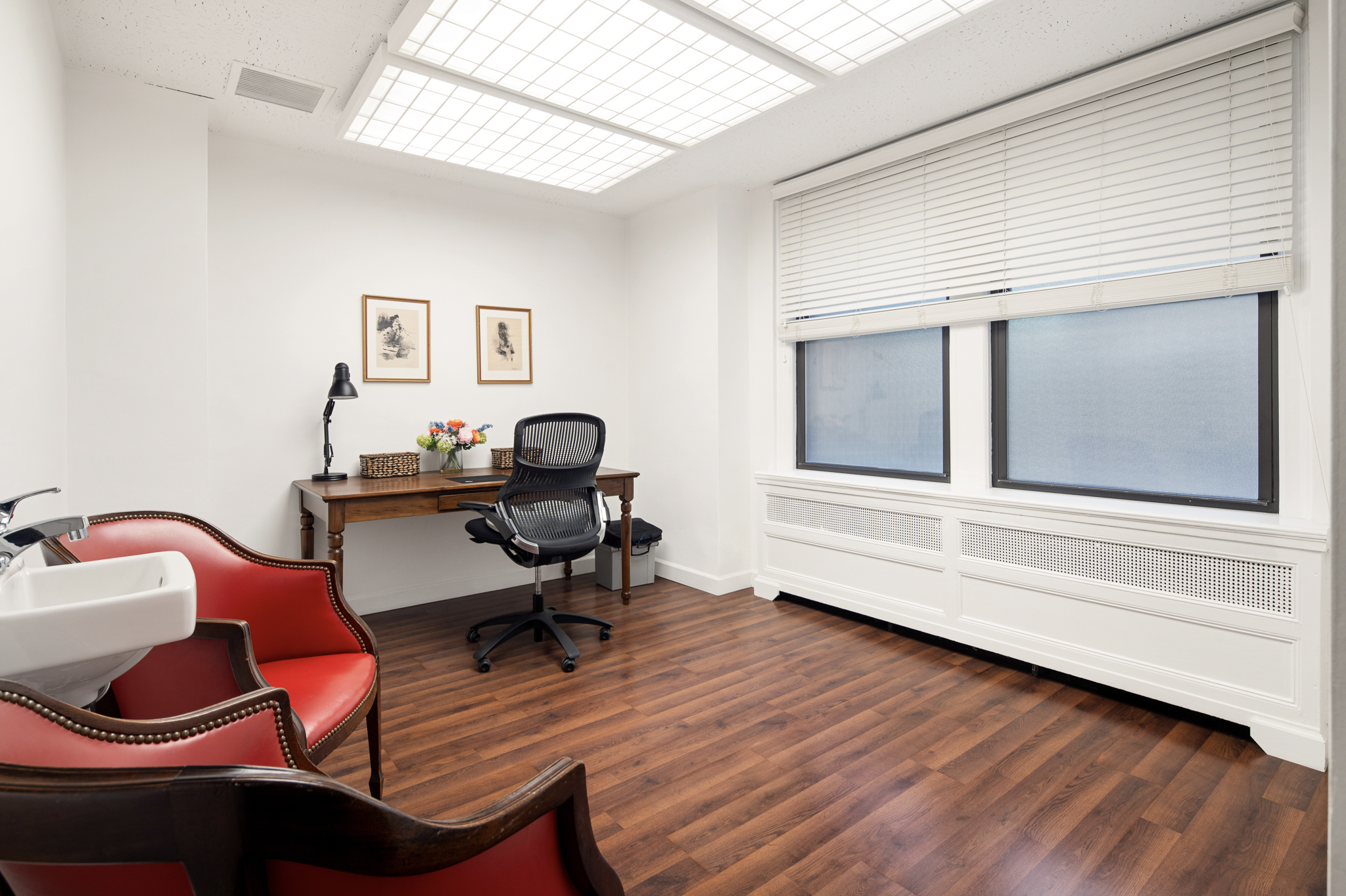 117 East 72nd Street, Unit 1WSR1C Manhattan, NY 10021 - Photo 3 of 7 a workspace with wooden floor