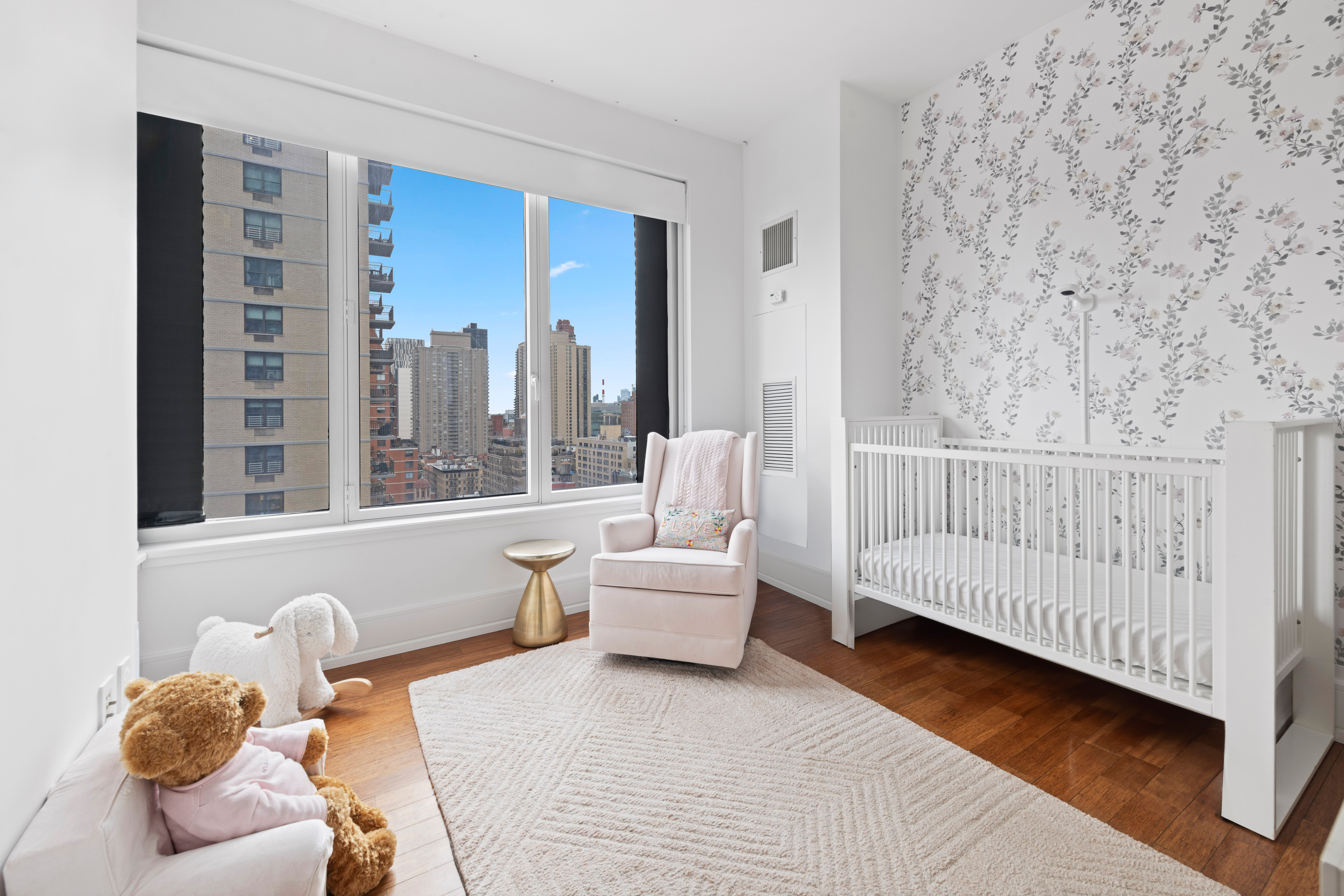 255 East 74th Street, Unit 14C Manhattan, NY 10021 - Photo 8 of 14 a bedroom with furniture and a large window