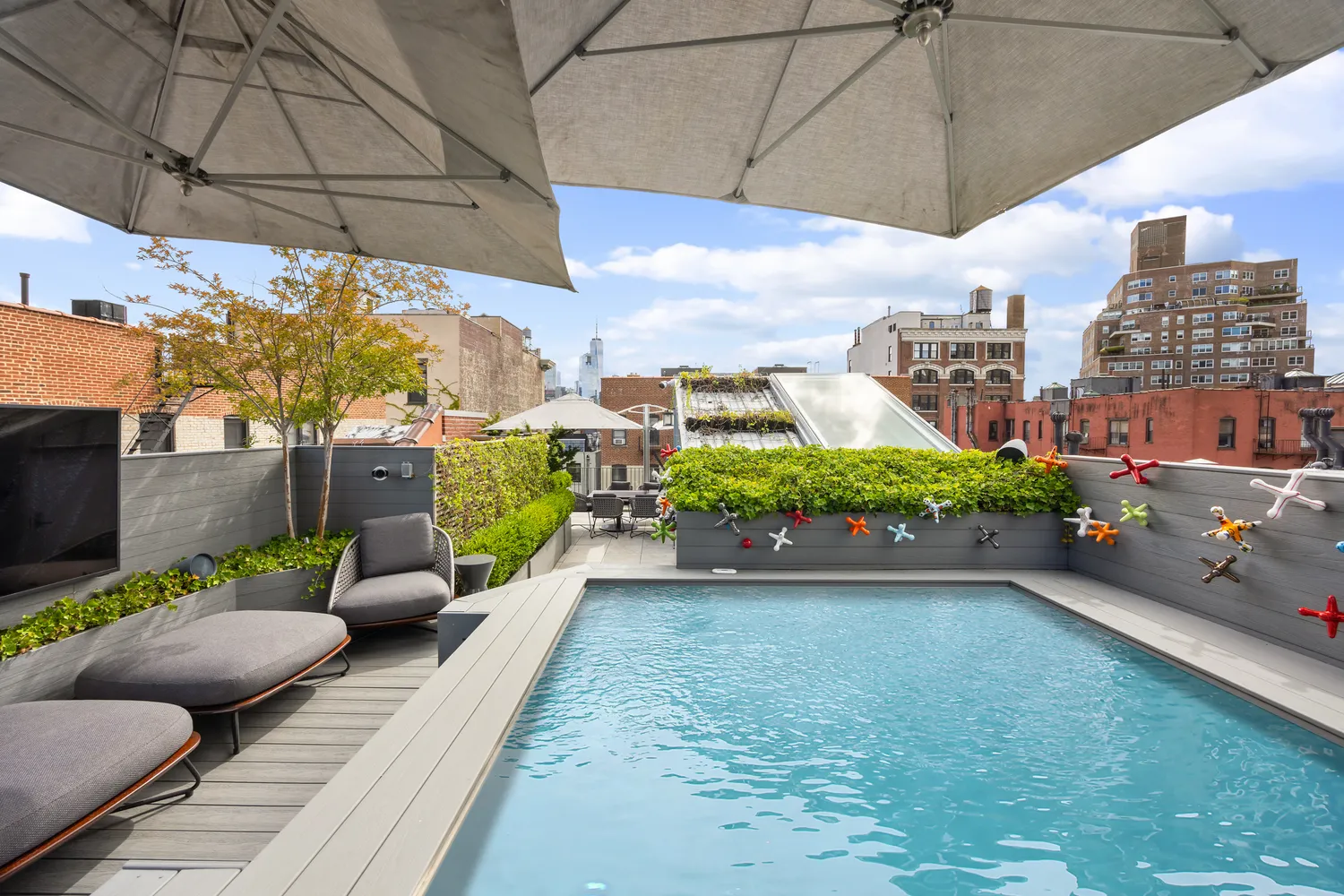a view of a patio with a table and chairs and potted plants