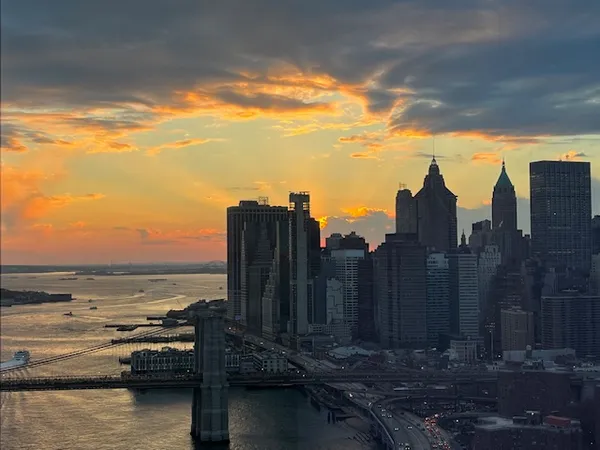 a view of a chair and table in backyard