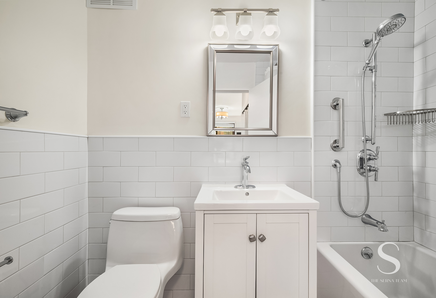 301 East 62nd Street, Unit 5E Manhattan, NY 10065 - Photo 5 of 15 a bathroom with a sink a toilet and shower