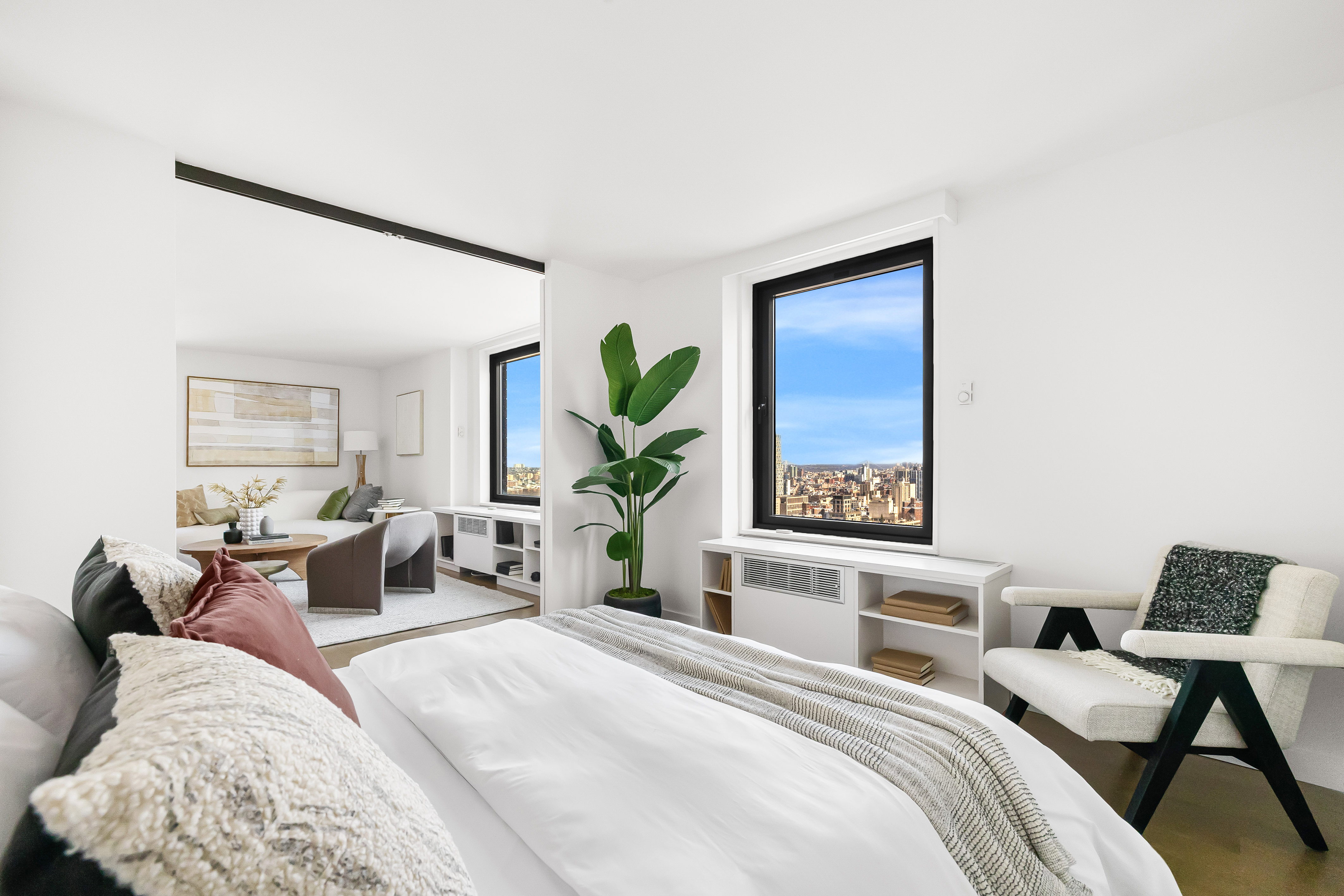 1623 3rd Avenue, Unit 36A Manhattan, NY 10128 - Photo 7 of 17 a bedroom with a bed and a potted plant