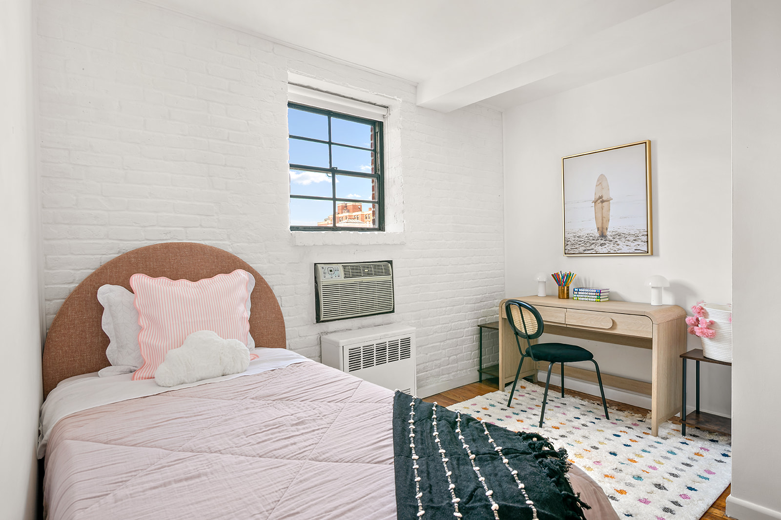 520 LaGuardia Place, Unit 6N Manhattan, NY 10012 - Photo 6 of 11 a bedroom with a bed and a window