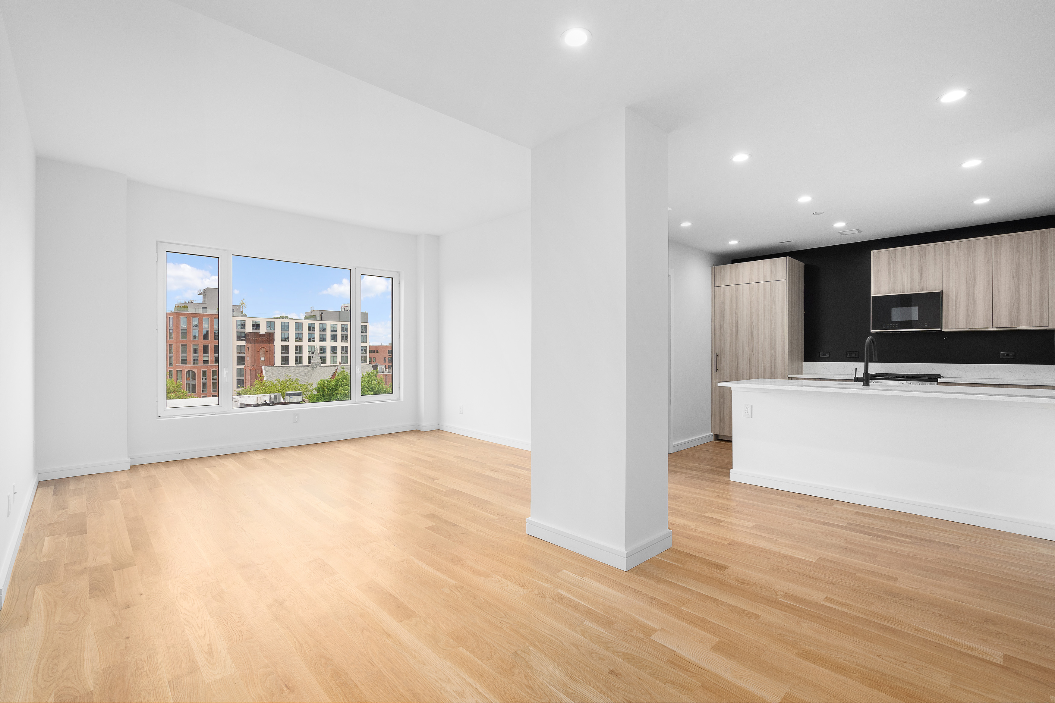 927 Atlantic Avenue, Unit 7A Brooklyn, NY 11238 - Photo 3 of 16 a view of kitchen with furniture and wooden floor