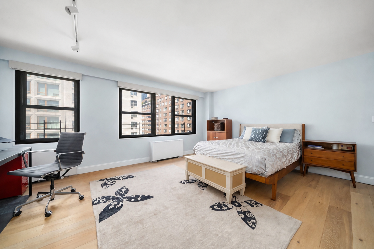 200 East 27th Street, Unit 7EF Manhattan, NY 10016 - Photo 5 of 13 a bedroom with a bed and wooden floor