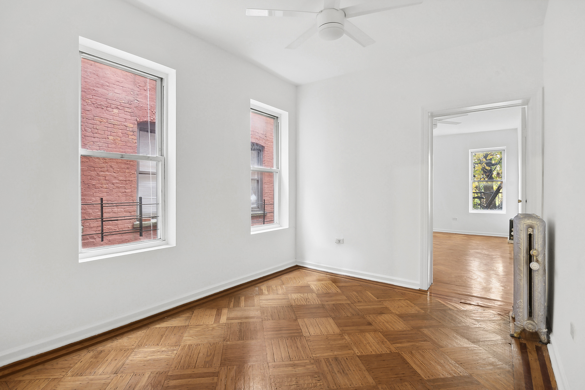 244 New York Avenue, Unit 3L Brooklyn, NY 11216 - Photo 3 of 7 an empty room with windows