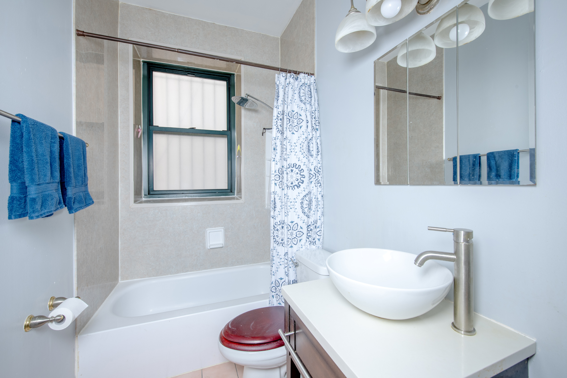 352 West 117th Street, Unit 1E Manhattan, NY 10026 - Photo 10 of 13 a bathroom with a sink a toilet and a bathtub