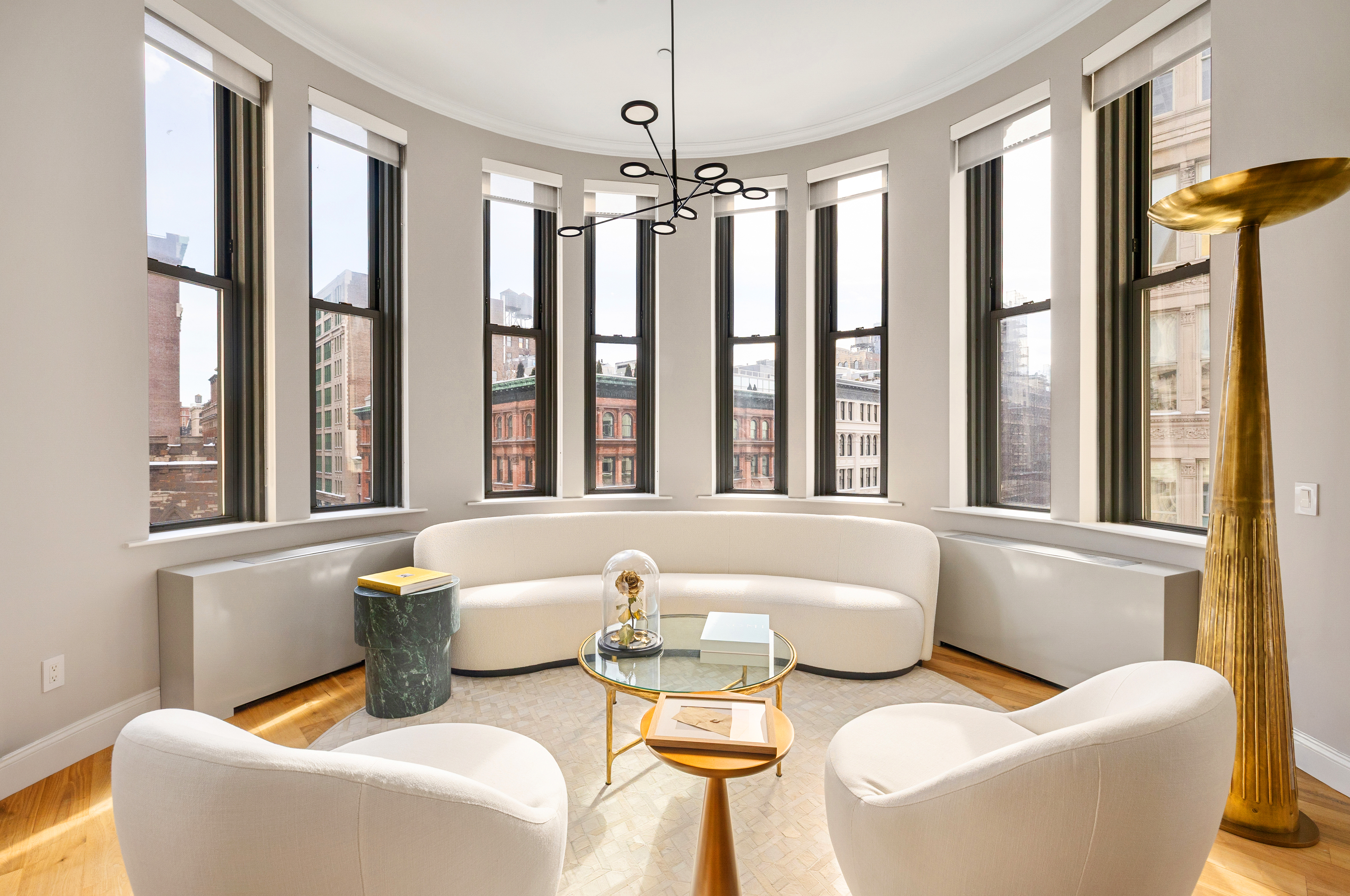 655 6th Avenue, Unit 5E Manhattan, NY 10010 - Photo 2 of 15 a living room with furniture and a large window