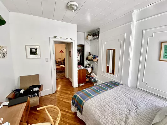 351 7th Avenue, Unit 2 Brooklyn, NY 11215 - Photo 8 of 10 a bedroom with a bed and wooden floor