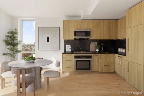 a kitchen with a sink cabinets and appliances
