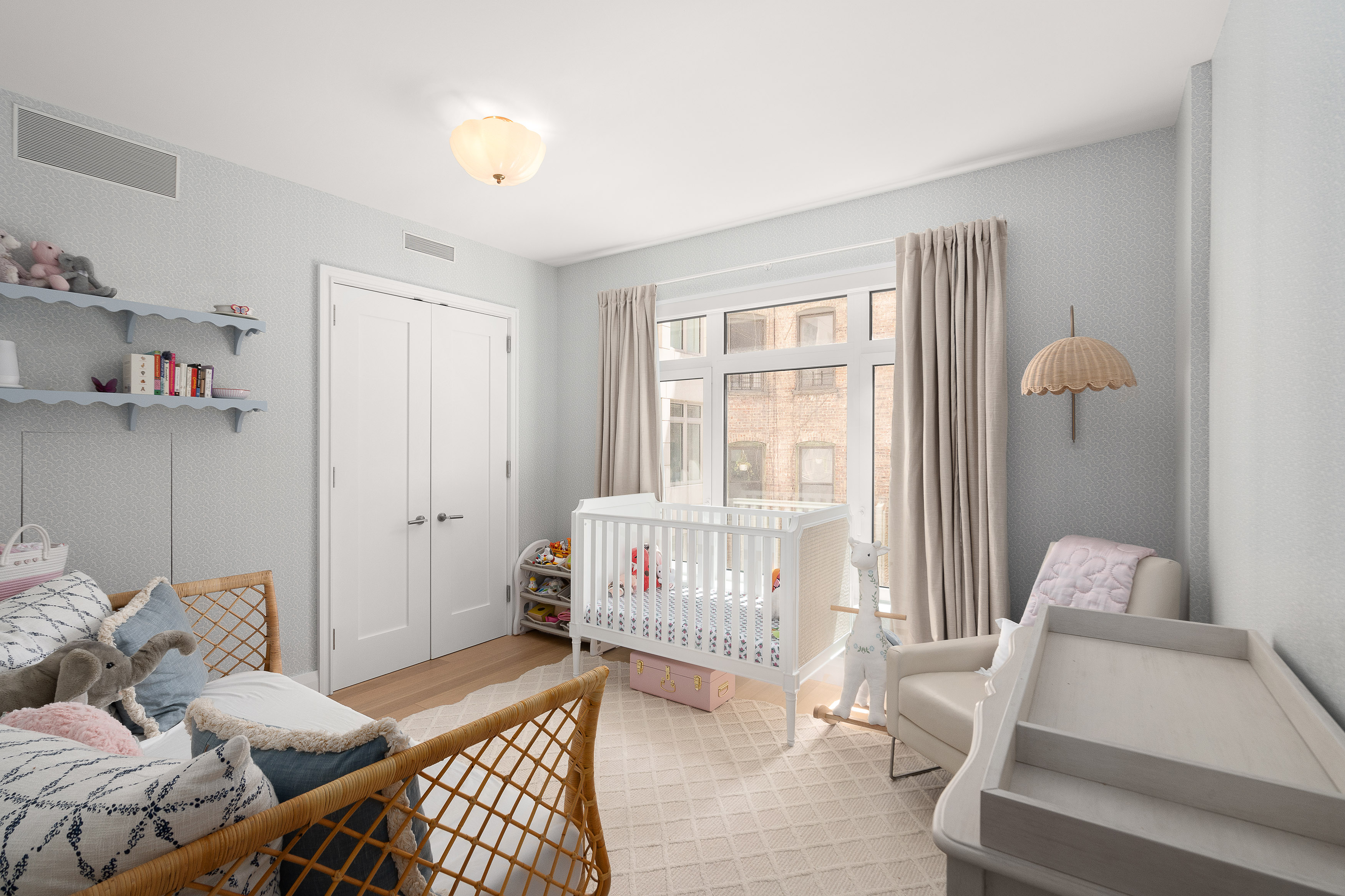 200 East 83rd Street, Unit 4E Manhattan, NY 10028 - Photo 14 of 29 a bedroom with furniture and a window