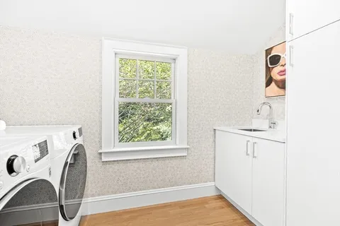 a spacious bedroom with a bed and glass door
