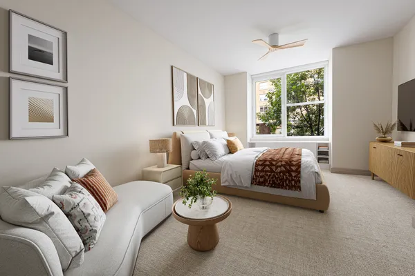 a bed room with a bed and a couch