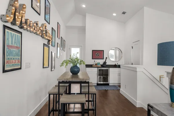 a kitchen with stainless steel appliances kitchen island granite countertop a stove a sink and a refrigerator