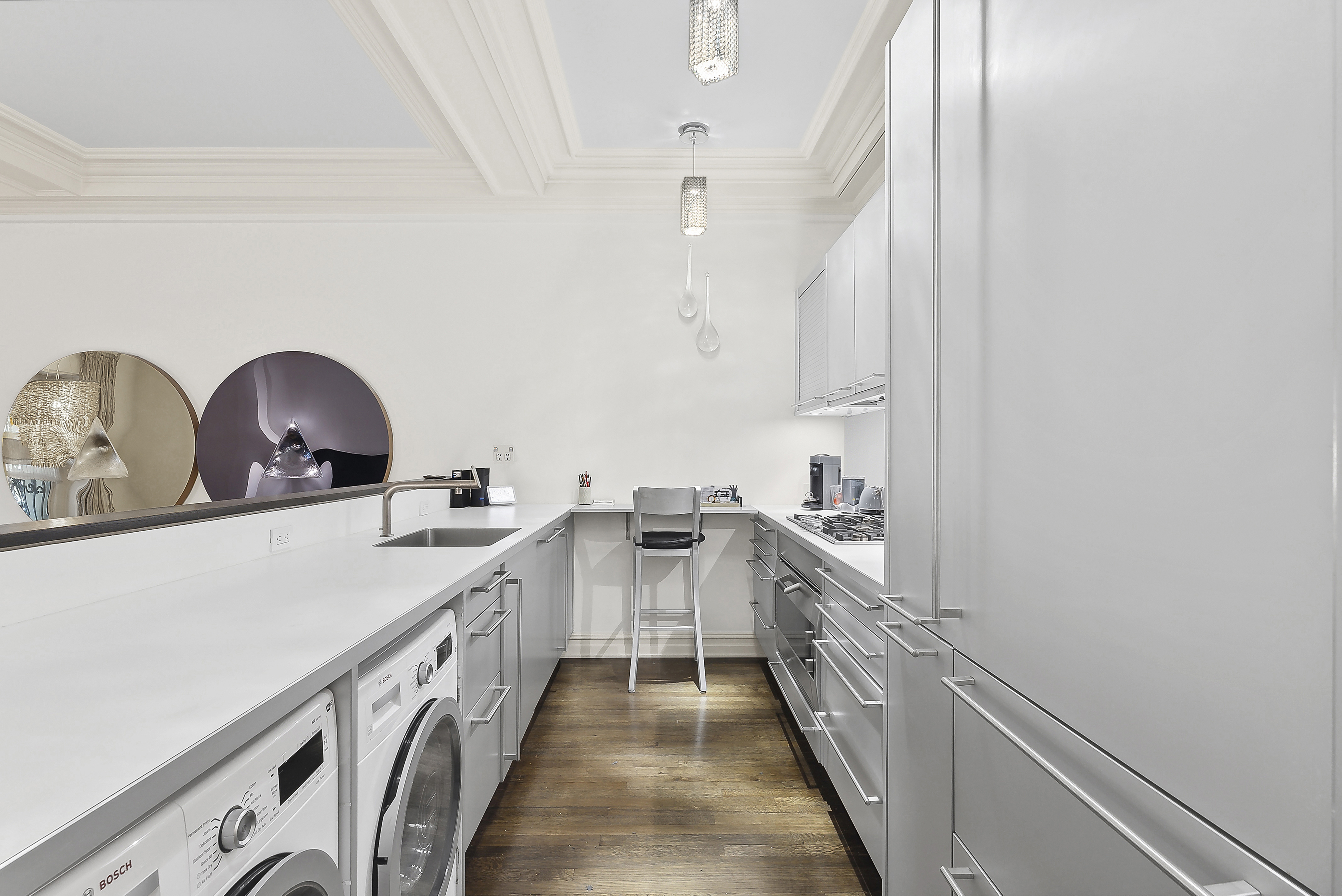 3 East 75th Street, Unit 1C Manhattan, NY 10021 - Photo 5 of 7 a kitchen with a sink and a stove top oven