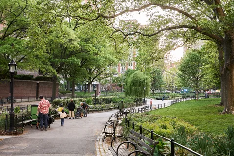a view of a lake with tall buildings