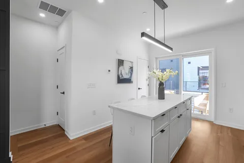 a bathroom with a sink a mirror and a shower