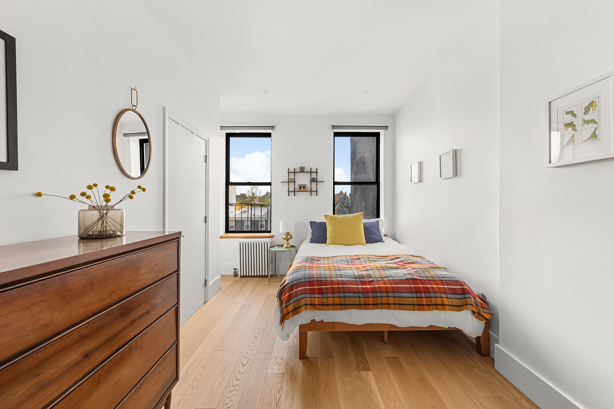 102 Clay Street, Unit 4 Brooklyn, NY 11222 - Photo 8 of 13 a bedroom with a bed and wooden floor