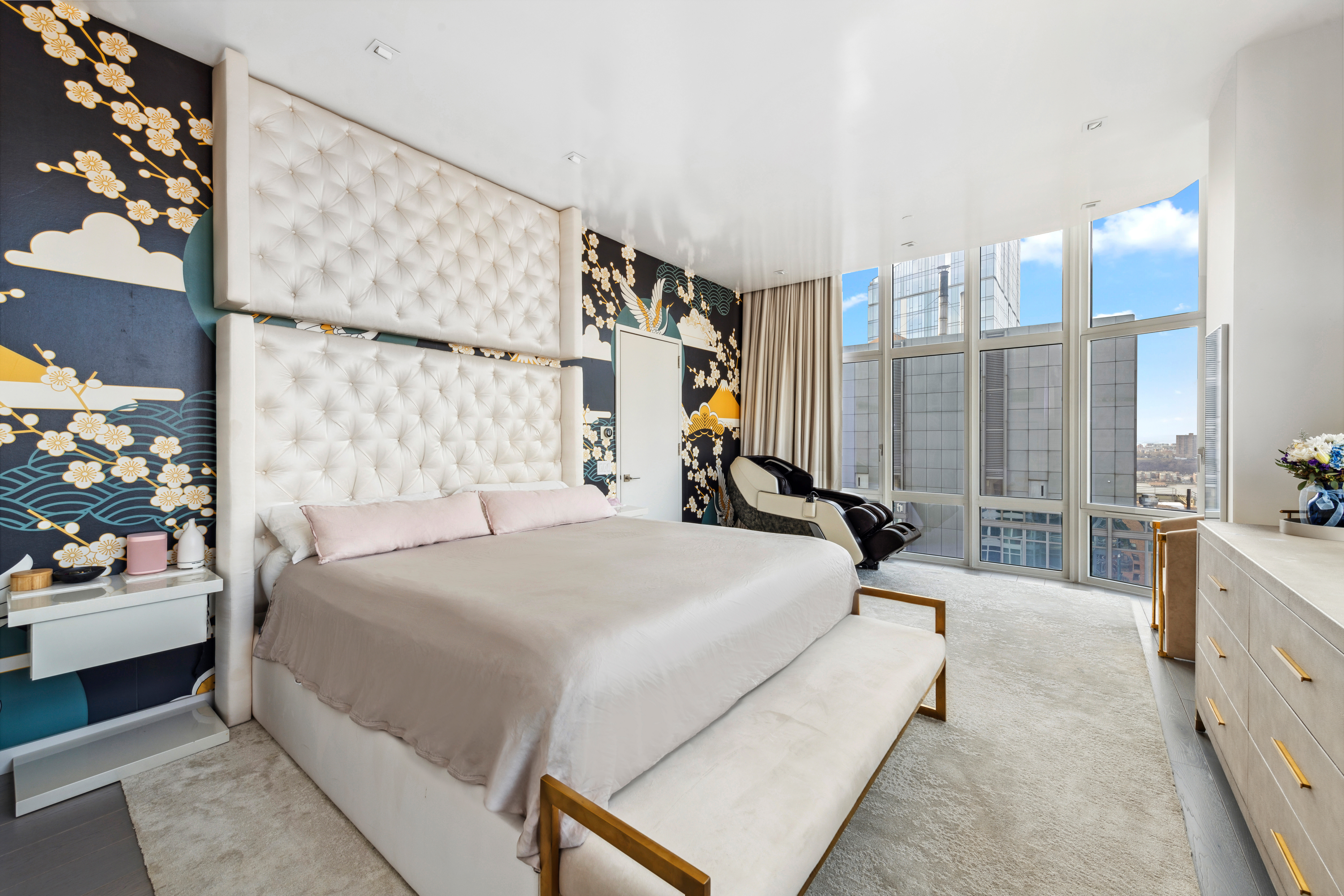 555 West 59th Street, Unit PHA Manhattan, NY 10019 - Photo 8 of 20 a bedroom with a large bed and a chandelier