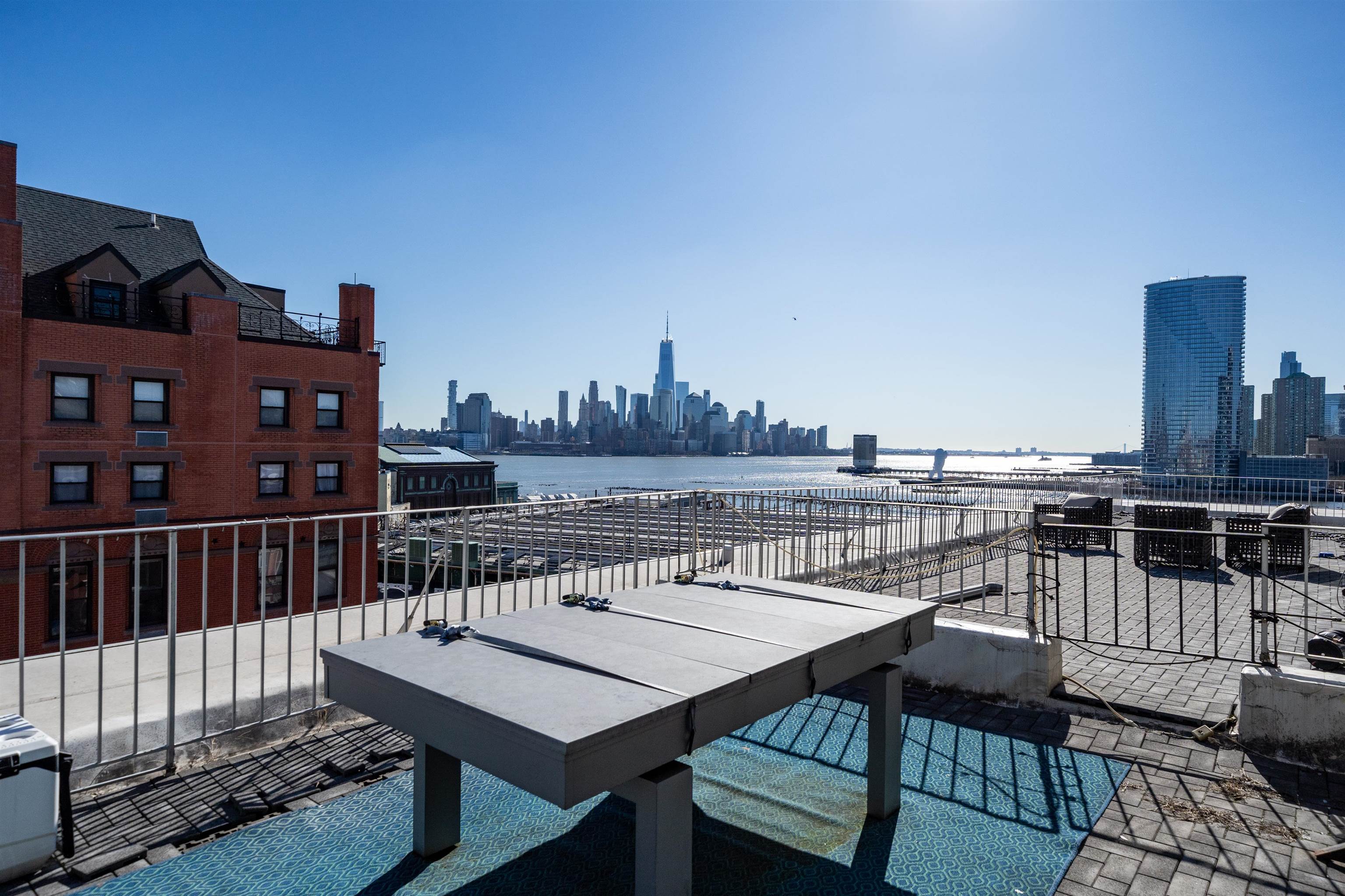 80 River Street, Unit PHNORTH Hoboken, NJ 07030 - Photo 10 of 24 a view of a roof deck with furniture