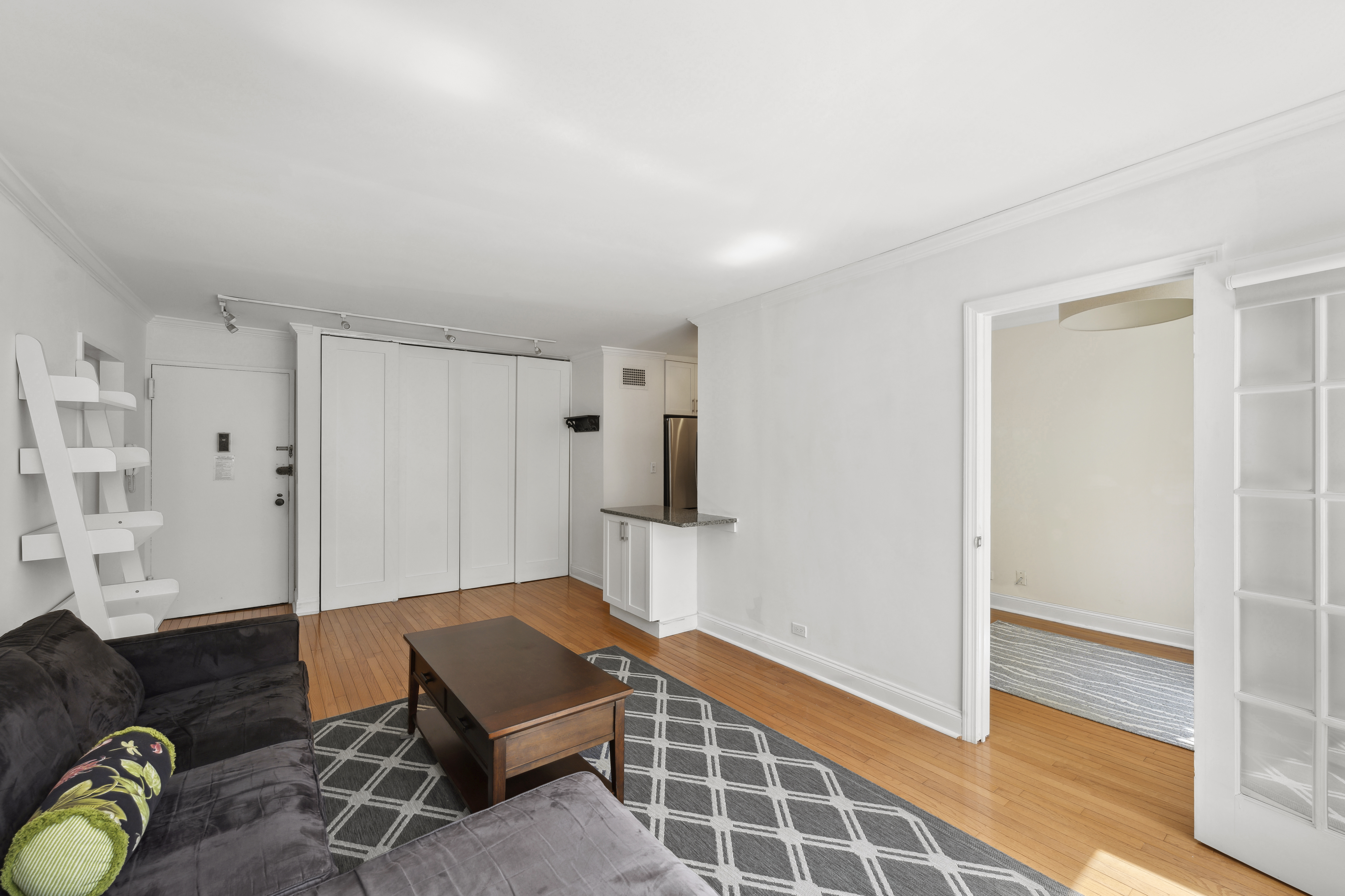 301 East 87th Street, Unit 16E Manhattan, NY 10128 - Photo 2 of 16 a living room with furniture