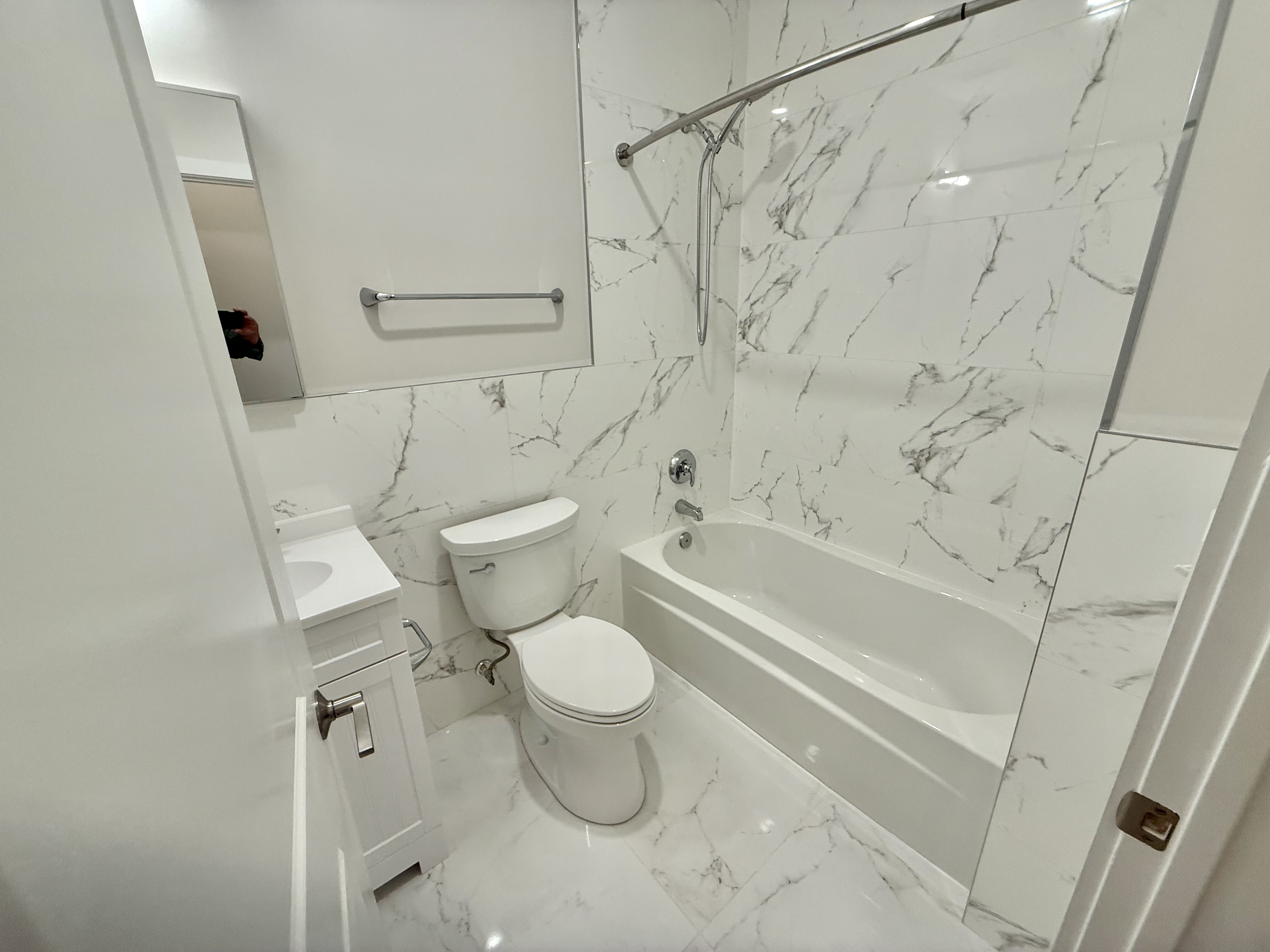 2009 Benning Road Northeast, Unit 2 Washington, DC 20002 - Photo 10 of 11 a bathroom with a toilet and a shower