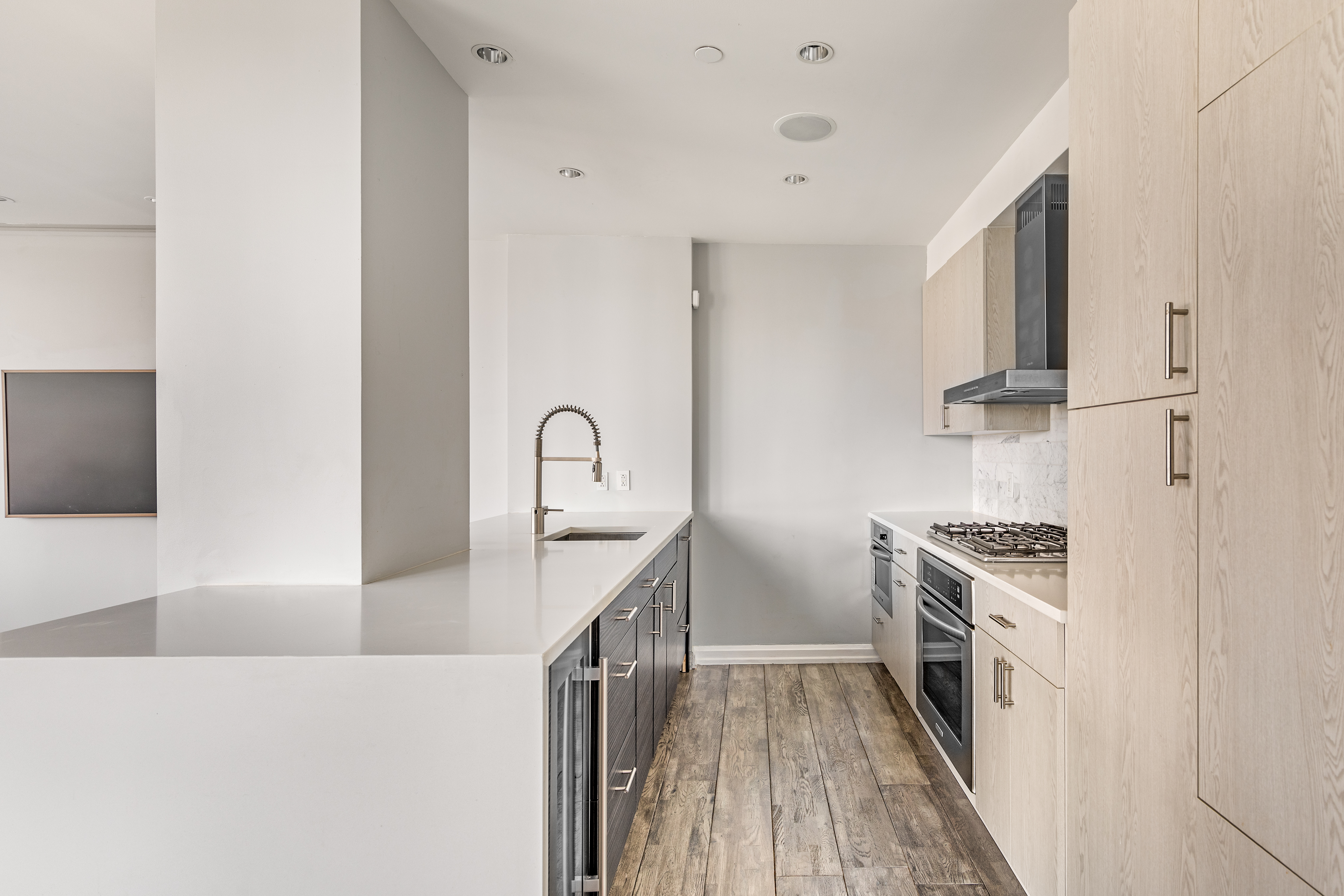 2300 Frederick Douglass Boulevard, Unit 9F Manhattan, NY 10027 - Photo 2 of 15 a kitchen view with stainless steel appliances a stove and a refrigerator