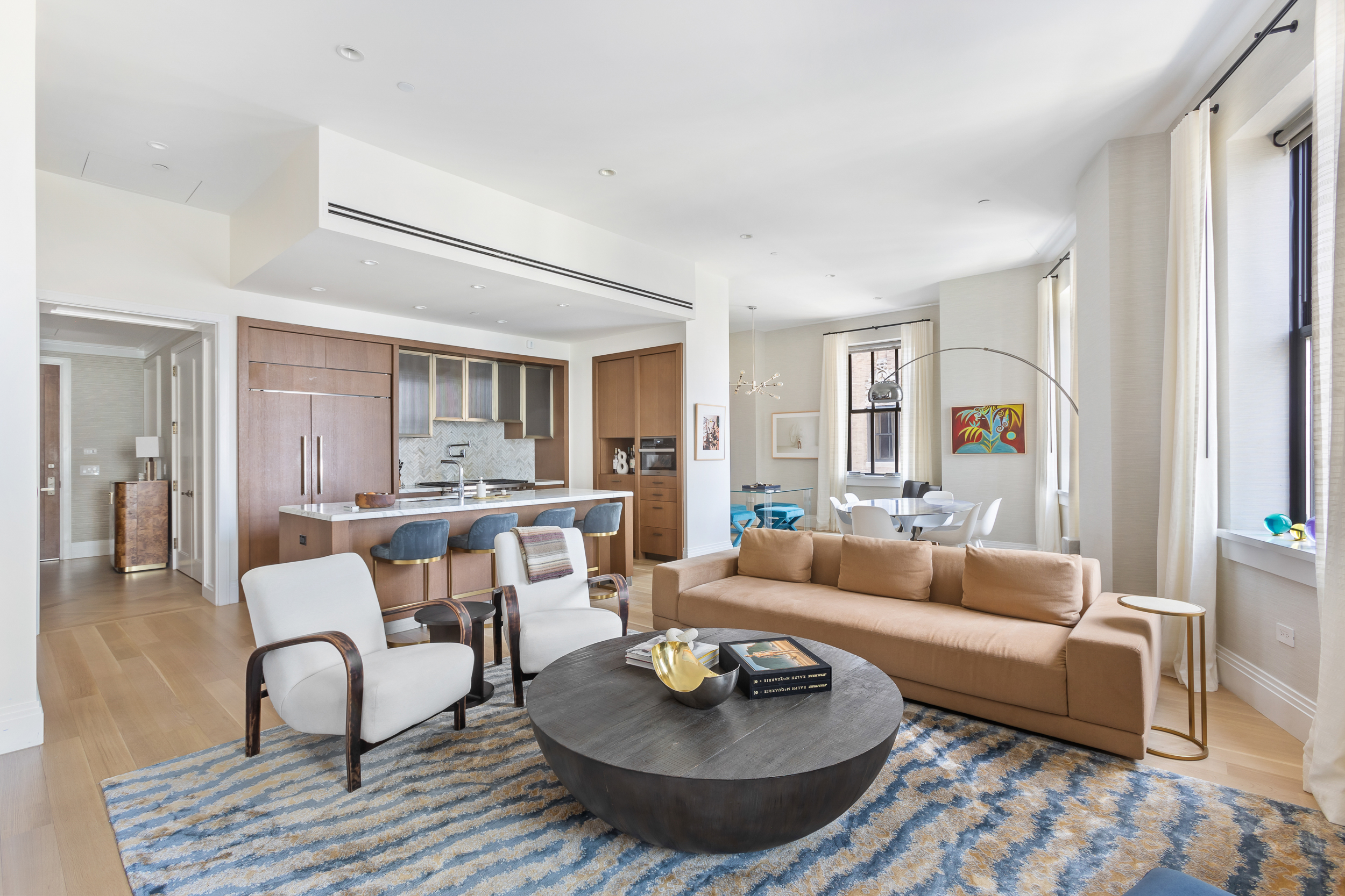 100 Barclay Street, Unit 17A Manhattan, NY 10007 - Photo 1 of 24 a living room with furniture and a wooden floor