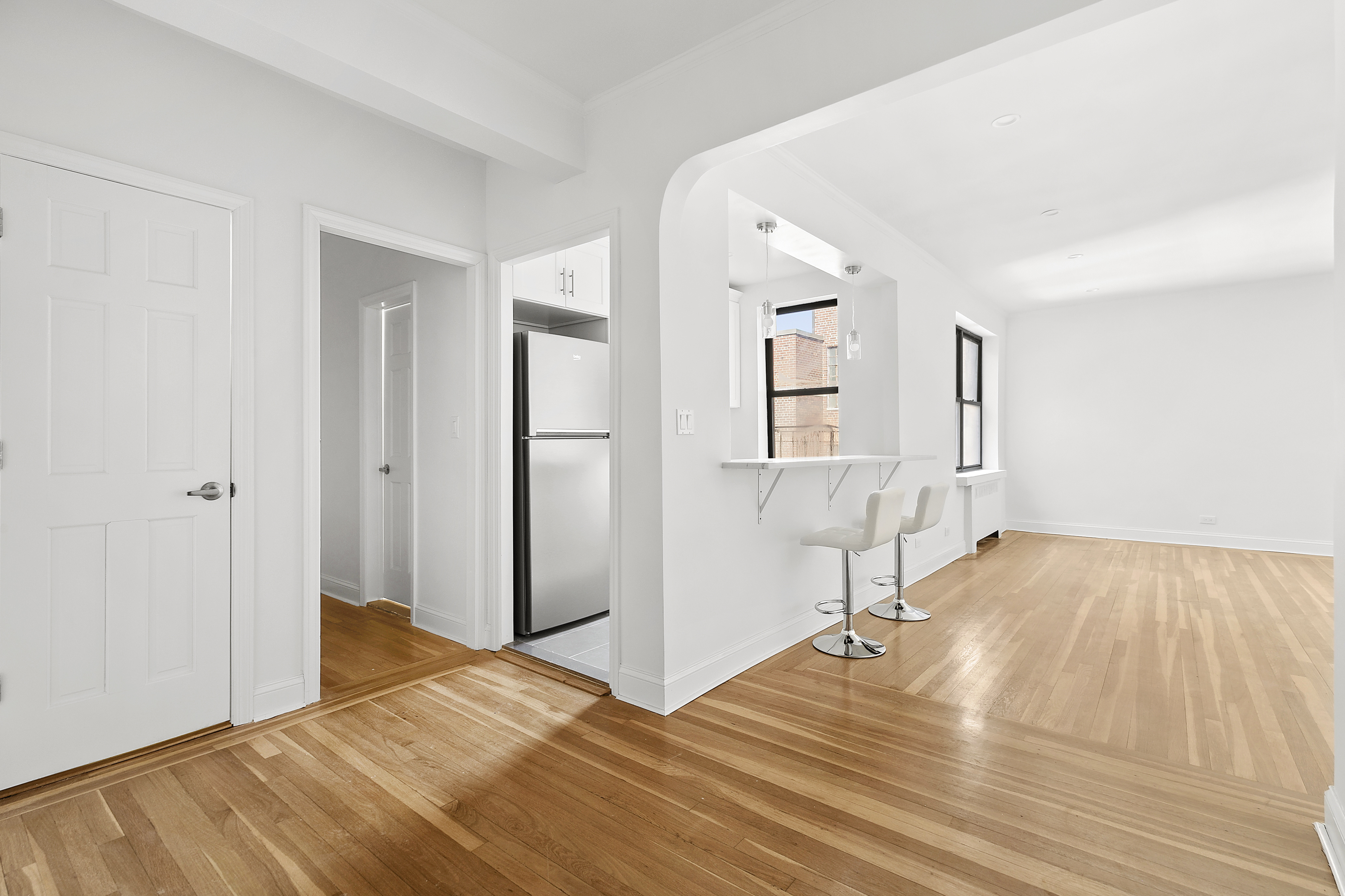 159-34 Riverside Drive West, Unit 7L90 Manhattan, NY 10032 - Photo 9 of 22 a view of empty room with wooden floor