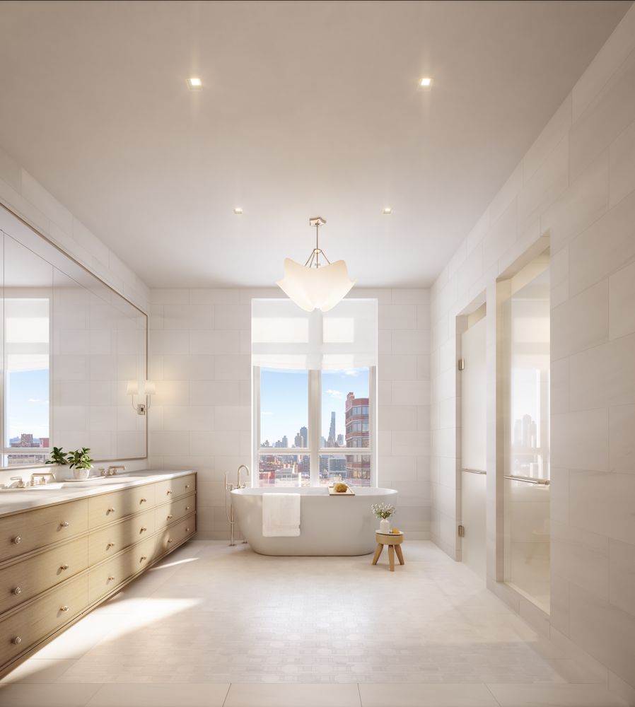 a bathroom with a tub a double vanity sink and mirror