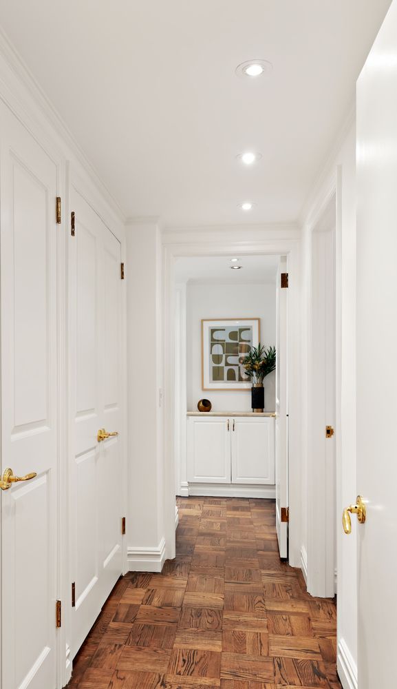 900 5th Avenue, Unit 4B Manhattan, NY 10021 - Photo 5 of 14 a view of a hallway with closet and bathroom