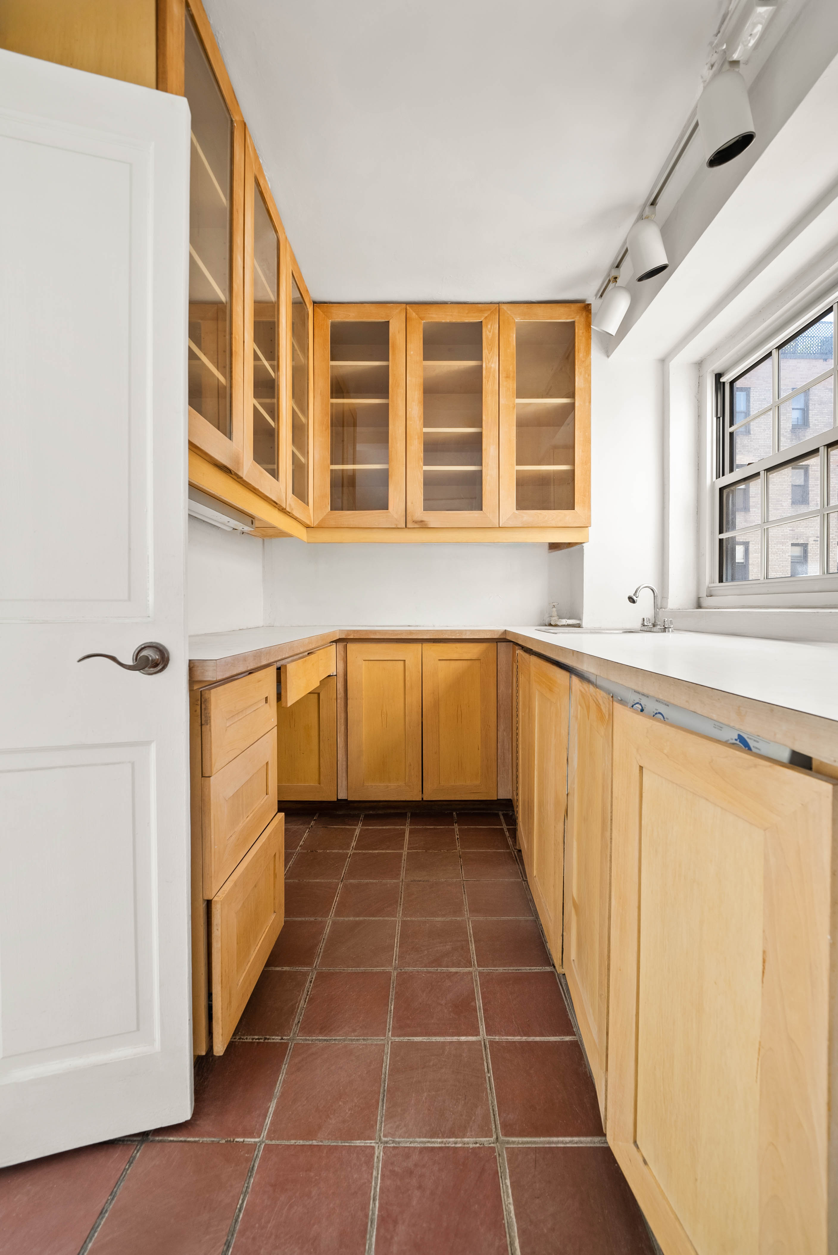 12 East 88th Street, Unit PH11/12B Manhattan, NY 10128 - Photo 13 of 22 a view of a kitchen with a sink