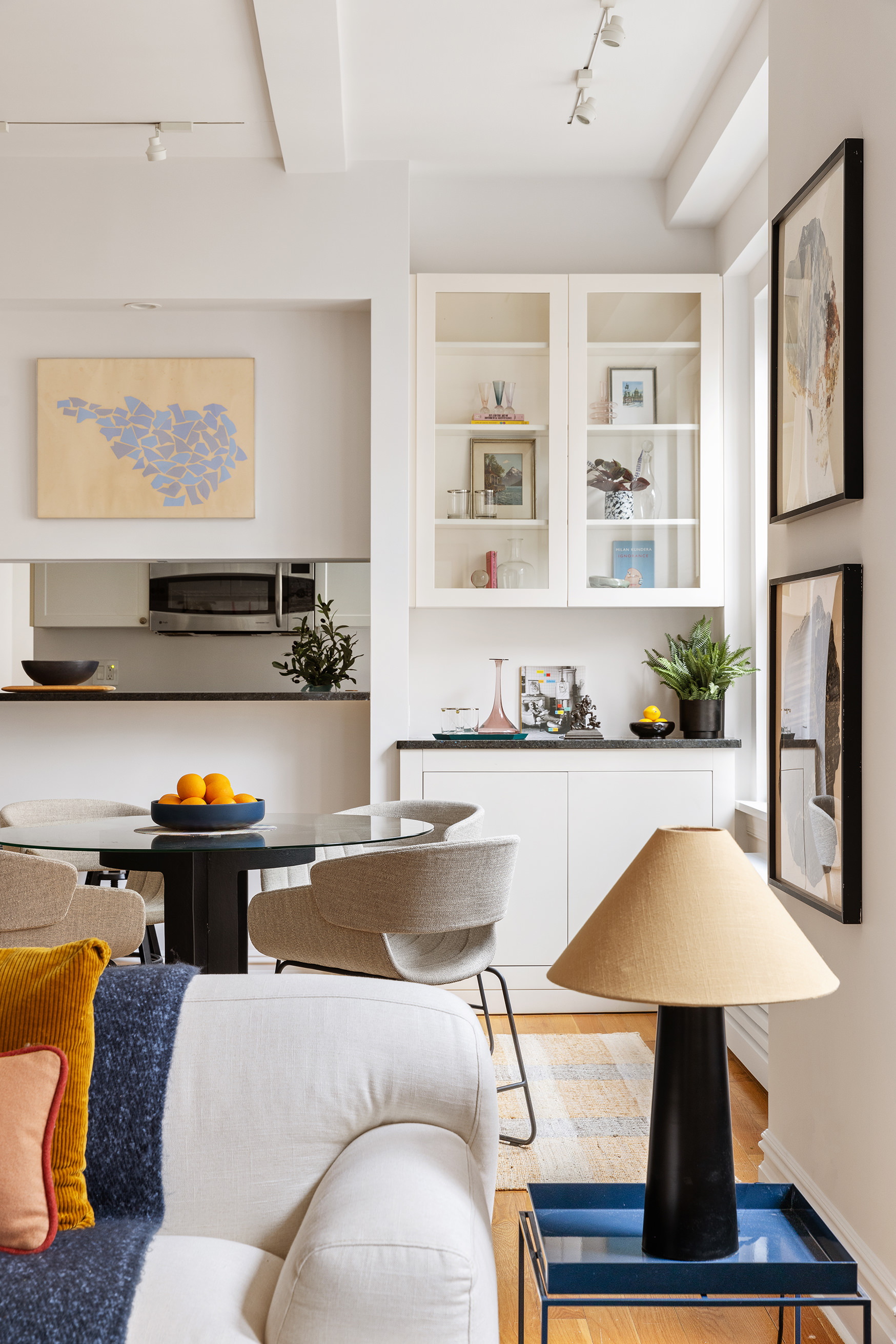 25 5th Avenue, Unit 9A Manhattan, NY 10003 - Photo 14 of 16 a living room with furniture and view of kitchen