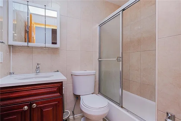 293 7th Avenue, Unit 3 Brooklyn, NY 11215 - Photo 8 of 9 a bathroom with a sink a toilet and shower