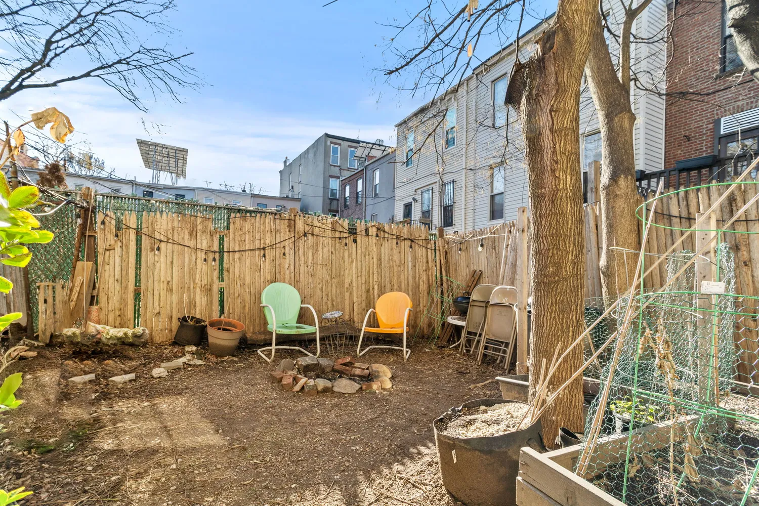 a view of a patio with chairs and potted plants