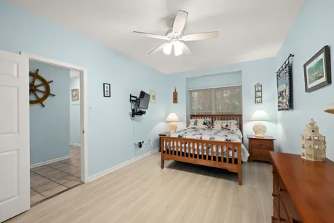 a bed room with bed and a window