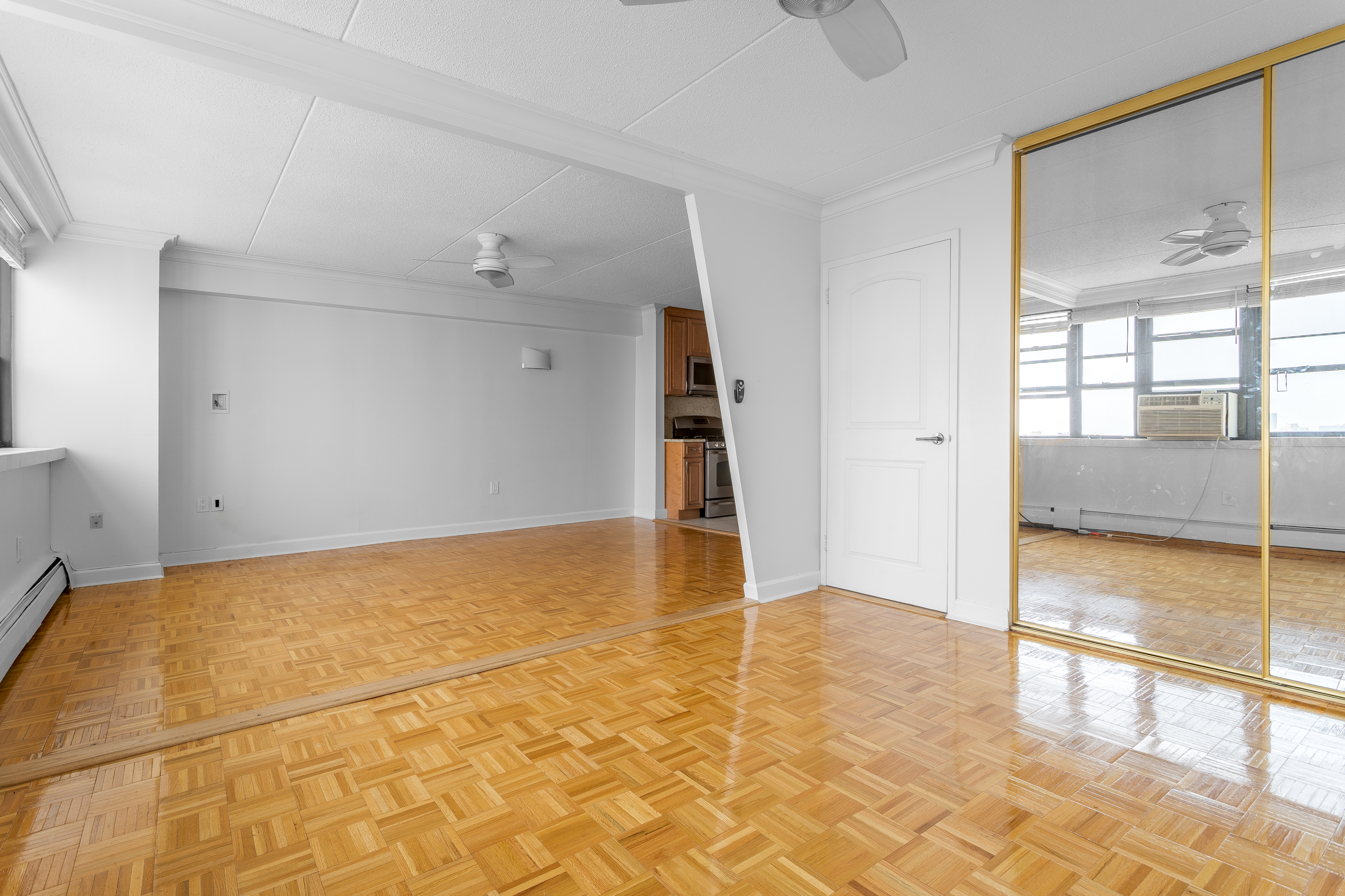 300 West 110th Street, Unit 16A Manhattan, NY 10025 - Photo 2 of 13 a view of an empty room and window