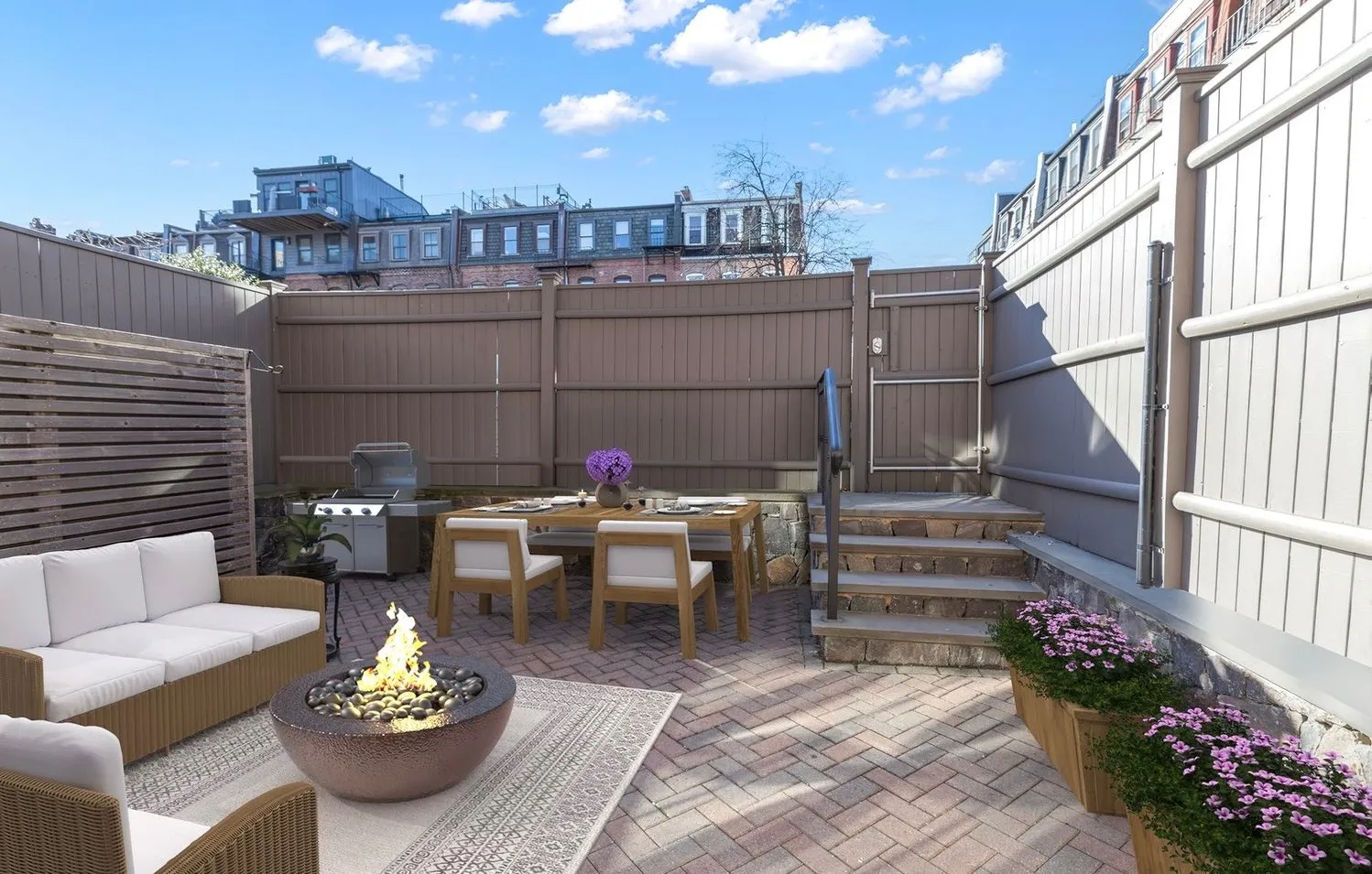 a view of a patio with couches table and chairs and potted plants