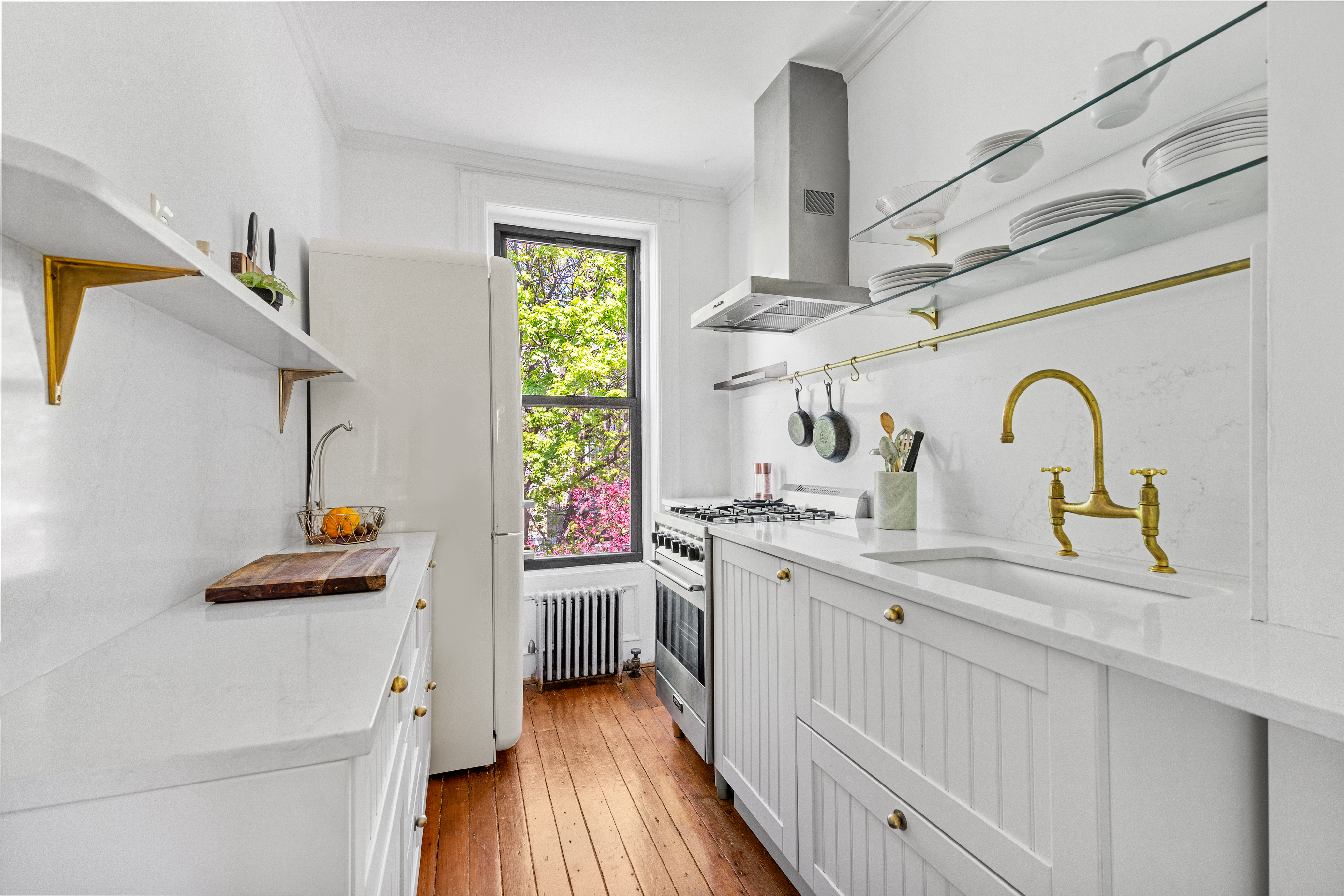 955 Bushwick Avenue Brooklyn, NY 11221 - Photo 5 of 19 a kitchen with stainless steel appliances a sink stove and cabinets
