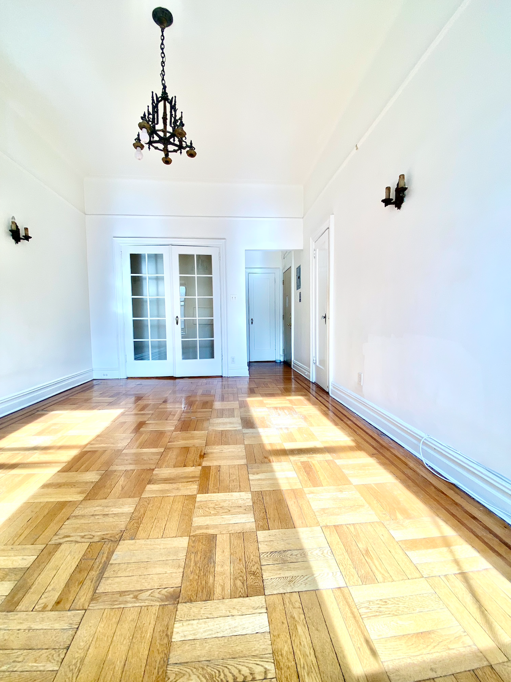 a view of an empty room with windows