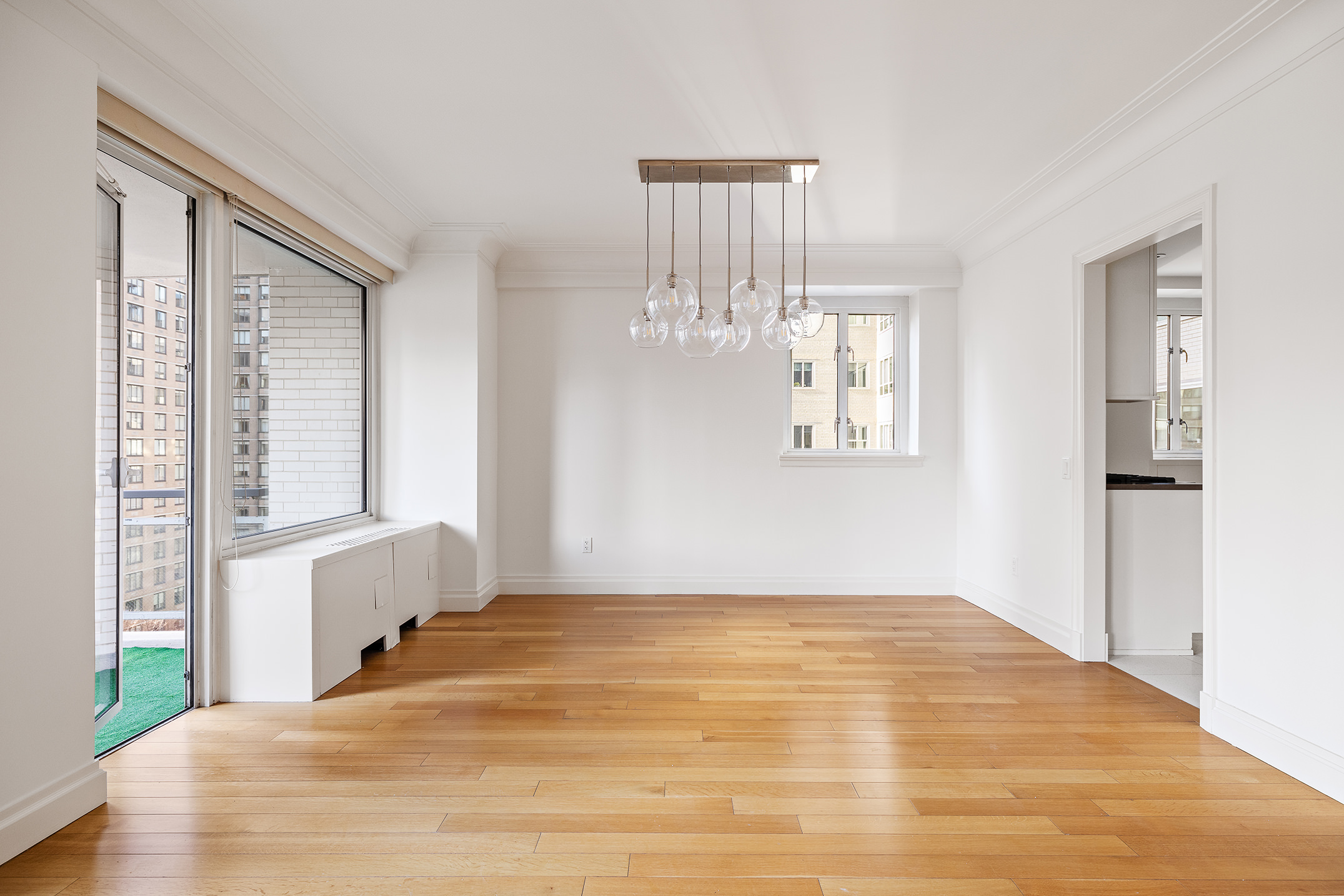 200 East 66th Street, Unit D1203 Manhattan, NY 10065 - Photo 9 of 24 a bedroom with a bed and a window