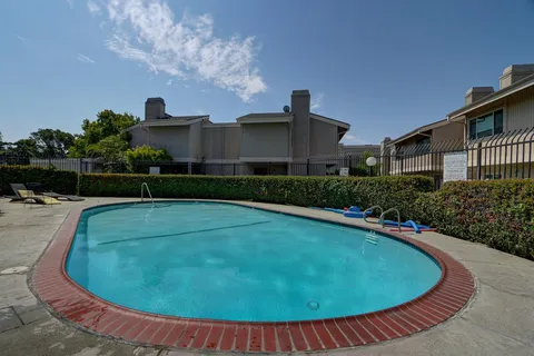 a view of a swimming pool with an outdoor space