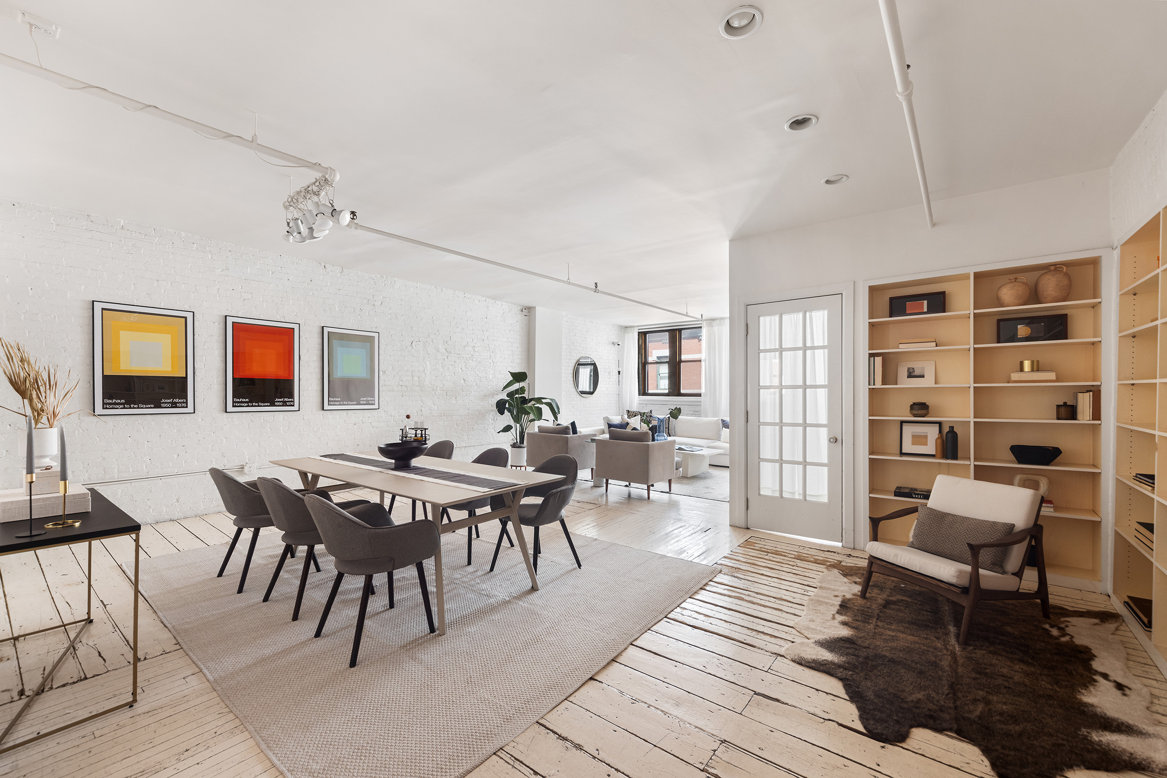 10 Leonard Street, Unit 6N Manhattan, NY 10013 - Photo 2 of 12 a view of a livingroom with furniture and window