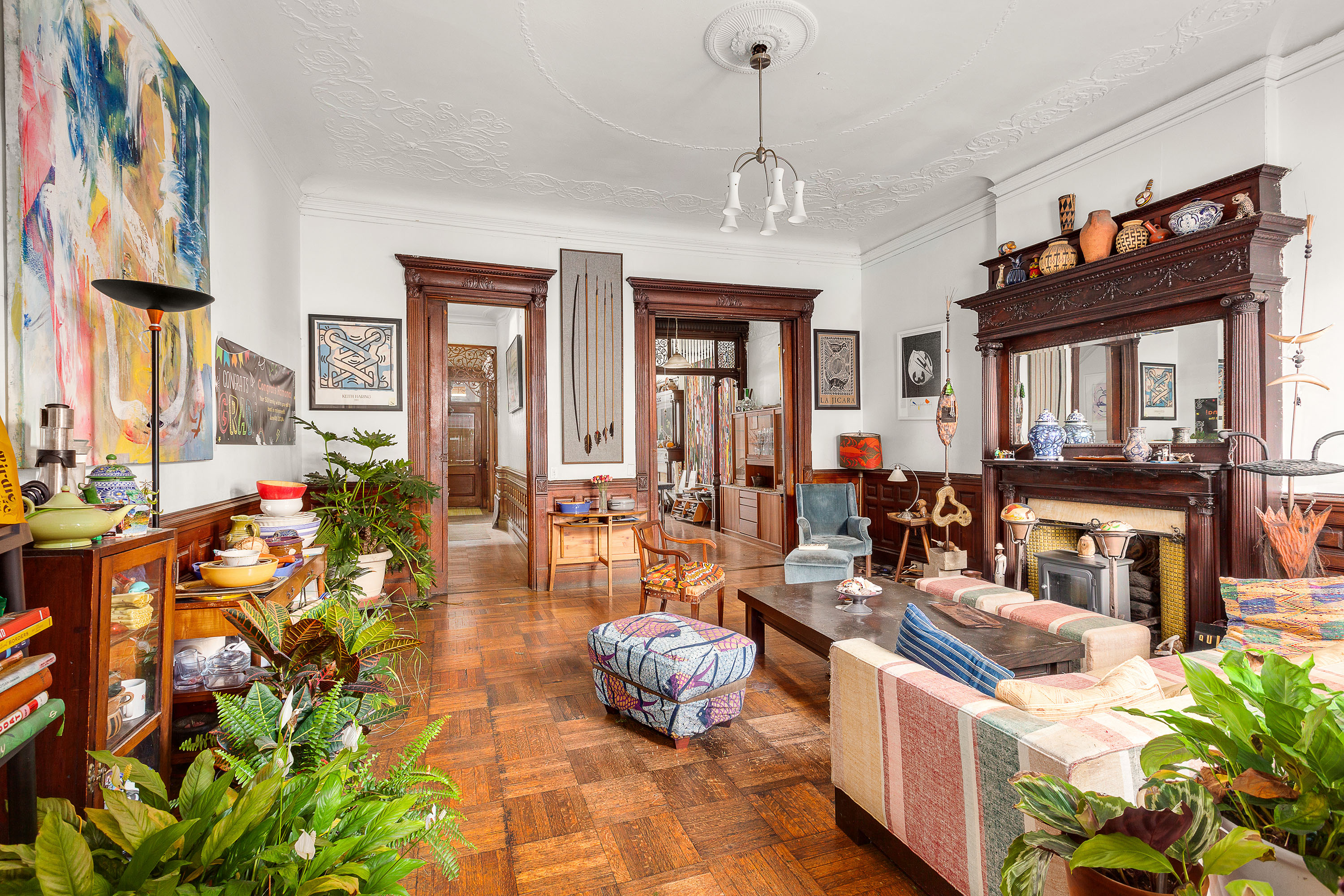 117 West 120th Street Manhattan, NY 10027 - Photo 13 of 31 a living room with fireplace furniture and a potted plant