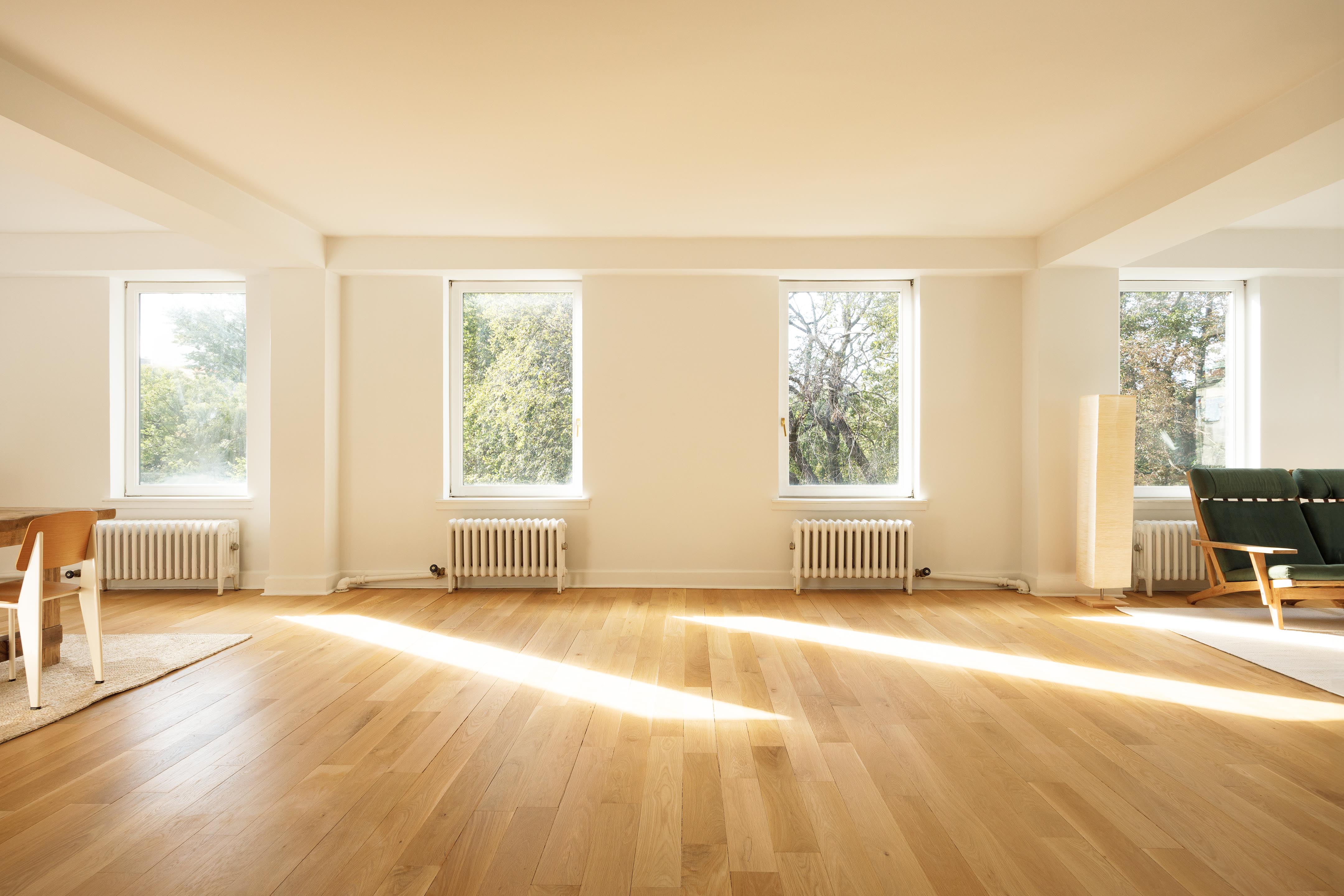 a view of a bedroom with furniture and a window